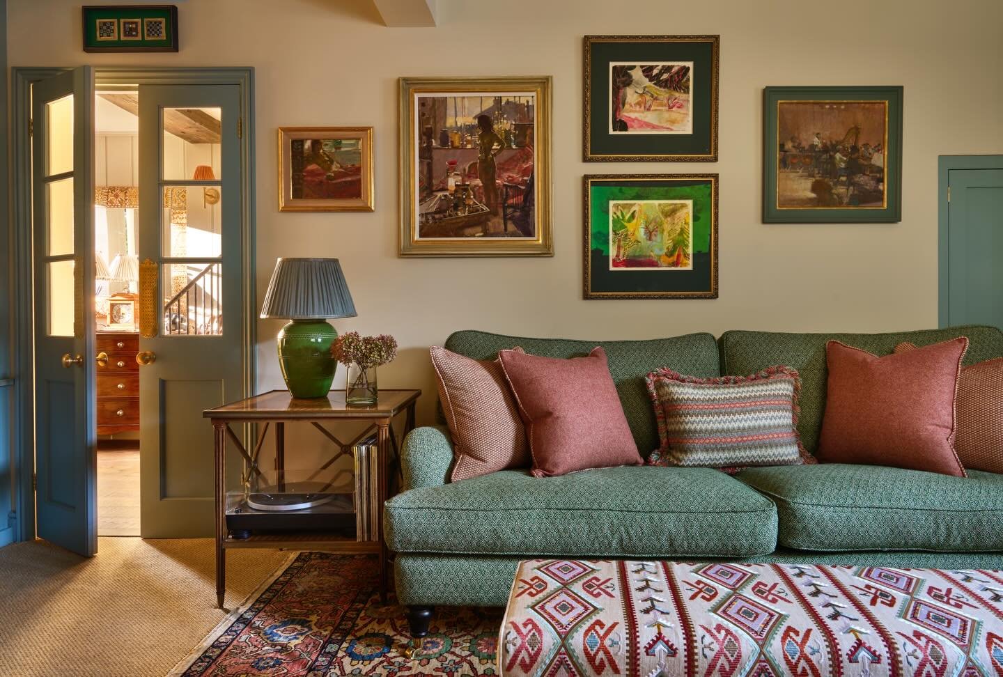 One of my favourite views of our recent Surrey cottage project. This room is so warm with textured greens, oranges, and blues. The client&rsquo;s art collection really makes this house something very special! 

📸 @darrenchung74
