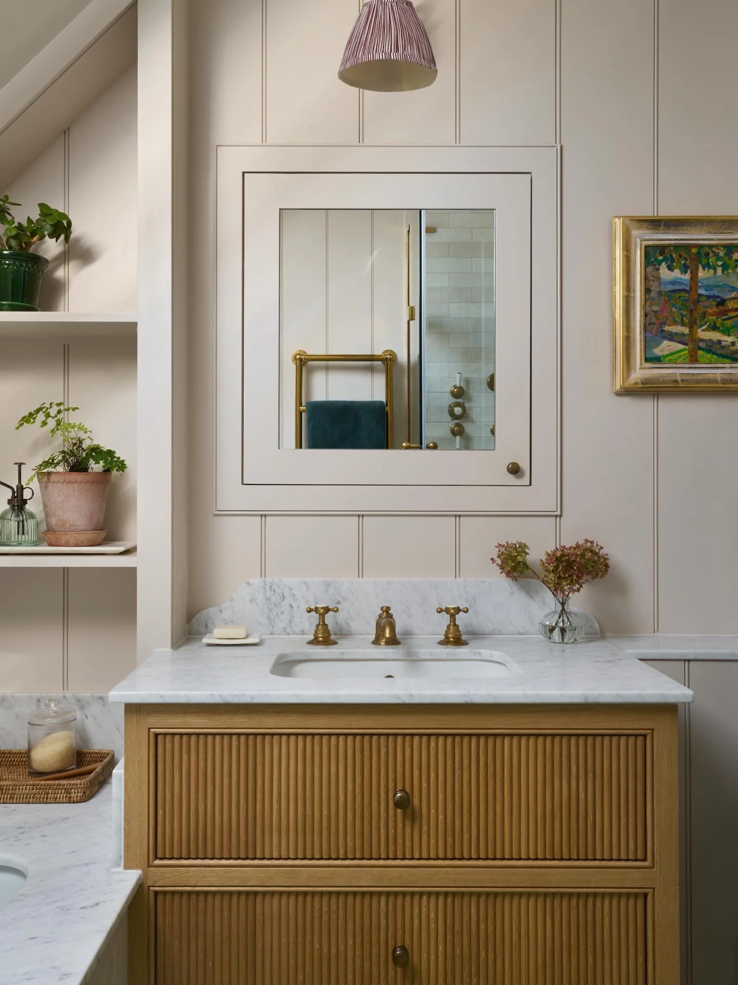 Such a sweet &amp; grounded country bathroom from a recent project. 

I love the mirrored cabinet that is recessed into the panelled walls. It gives that extra storage without cluttering the space.  Space was limited so the vanity is tight to the bat