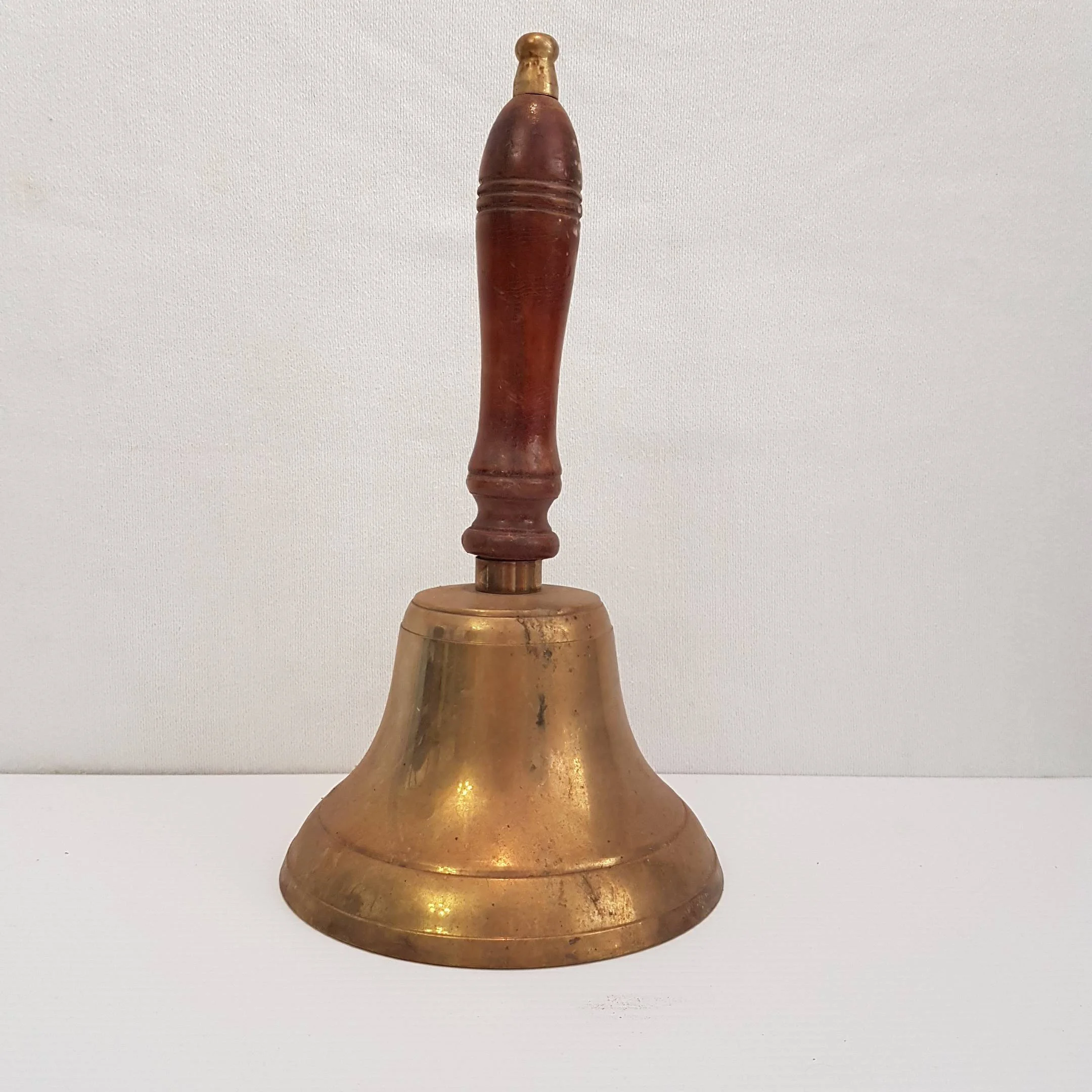 We still use an old school bell and we love it!