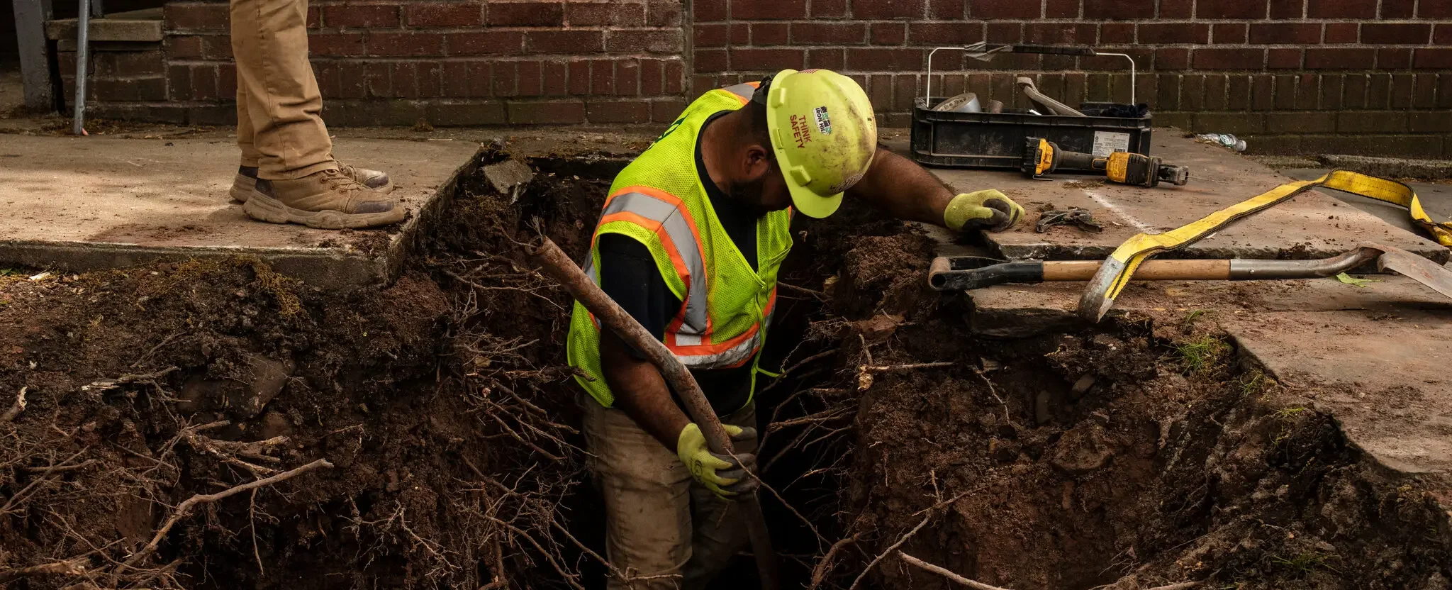 worker man removing lead pipes
