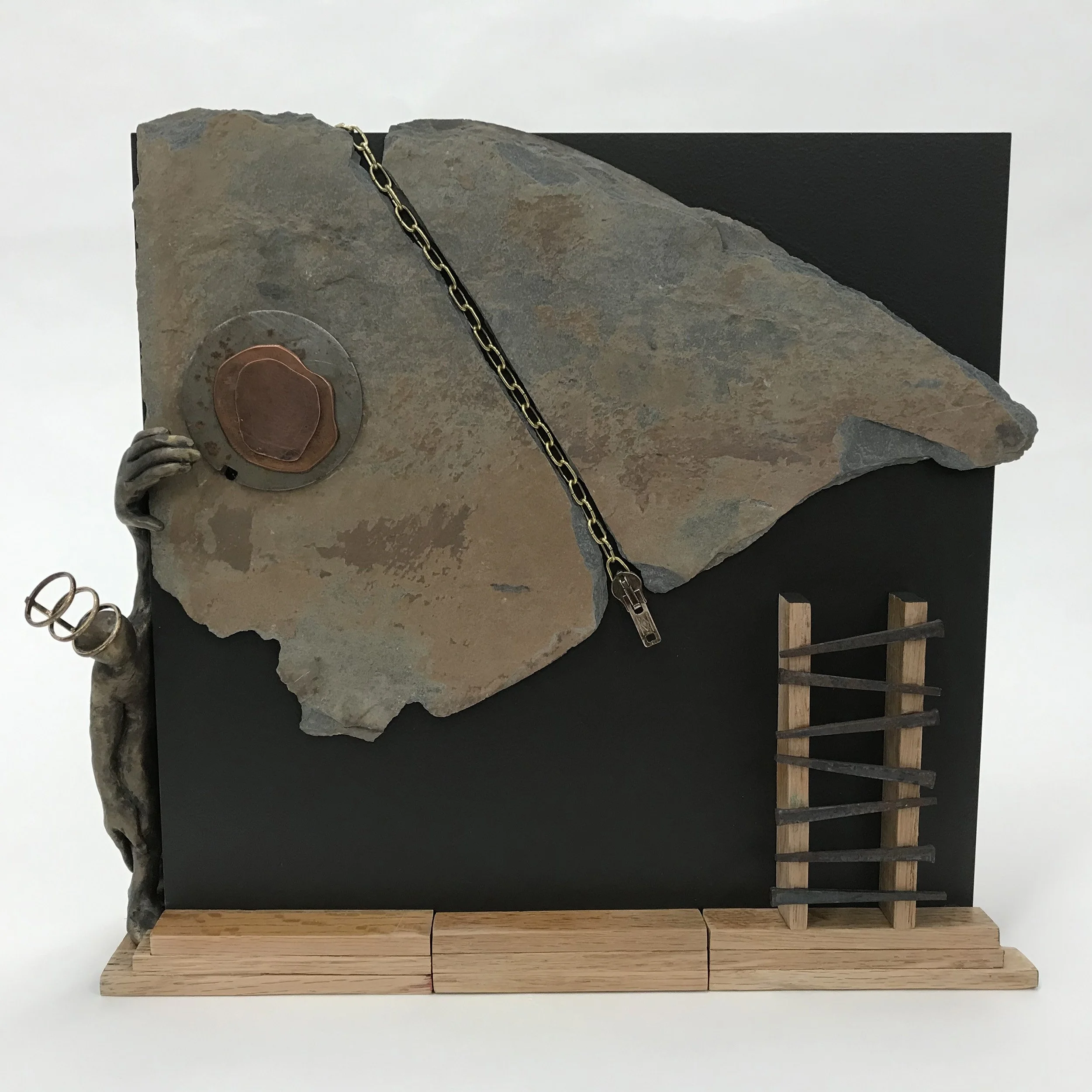 Stage Fright Assemblage, Wall Sculpture 12 × 14 × 4” slate, clay, copper, wood nails, zipper