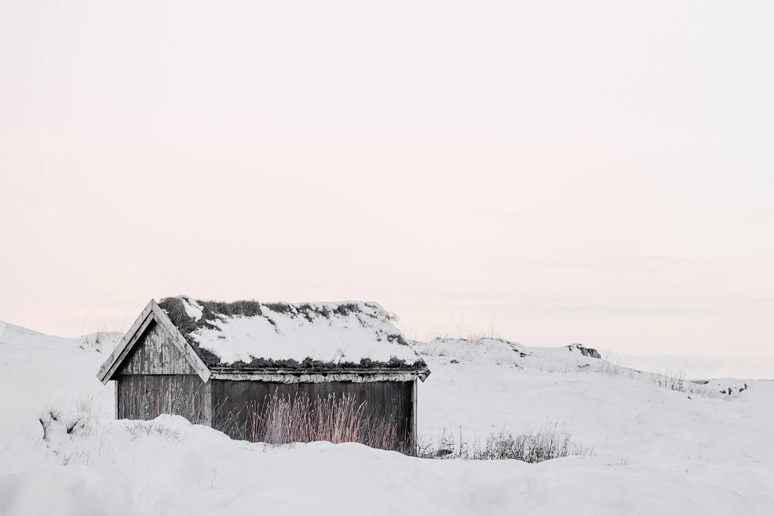 Bodø, Norway - The historic stall at Nordlandsmuseet, buried in Arctic snow. Even the simplest shelter must endure a winter that tries to hide everything it covers.