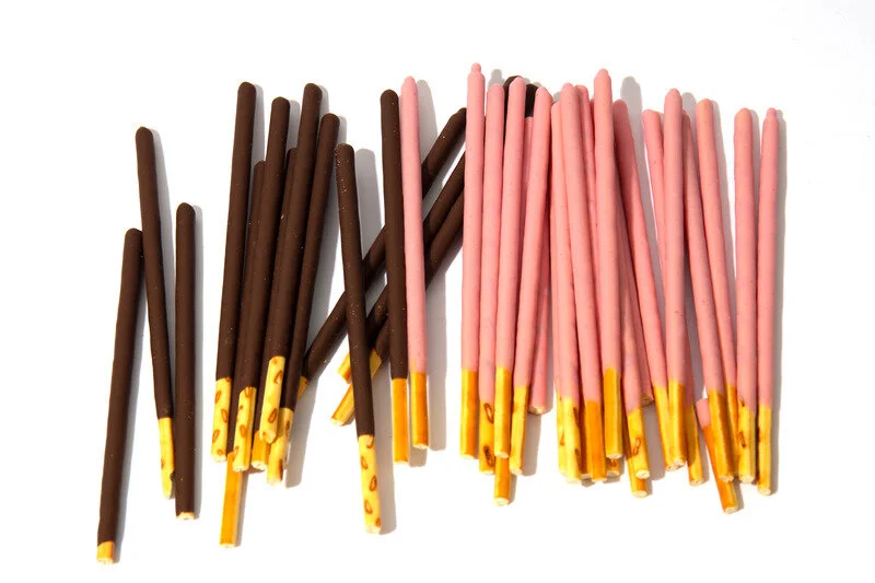 Canva - Pocky candy background.Box for cookies with bright flogging.Japan sweets. Bright white background.jpg