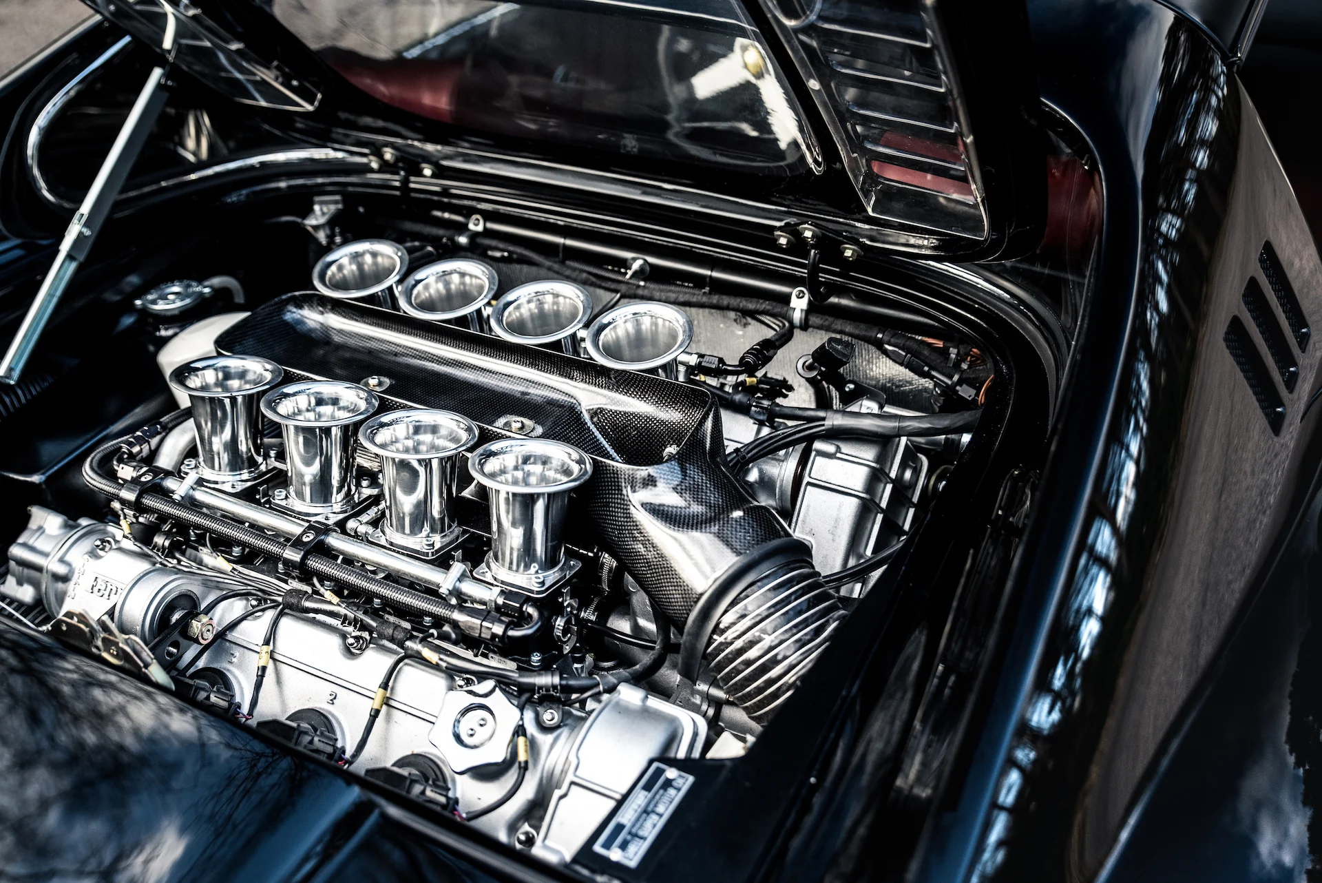 Visually spectacular, this completed Ferrari 3.6 Litre V8 engine producing 400bhp was designed and built by Moto Technique Engineering. The photo shows it mounted in the back of a Dino 246 “Outlaw”