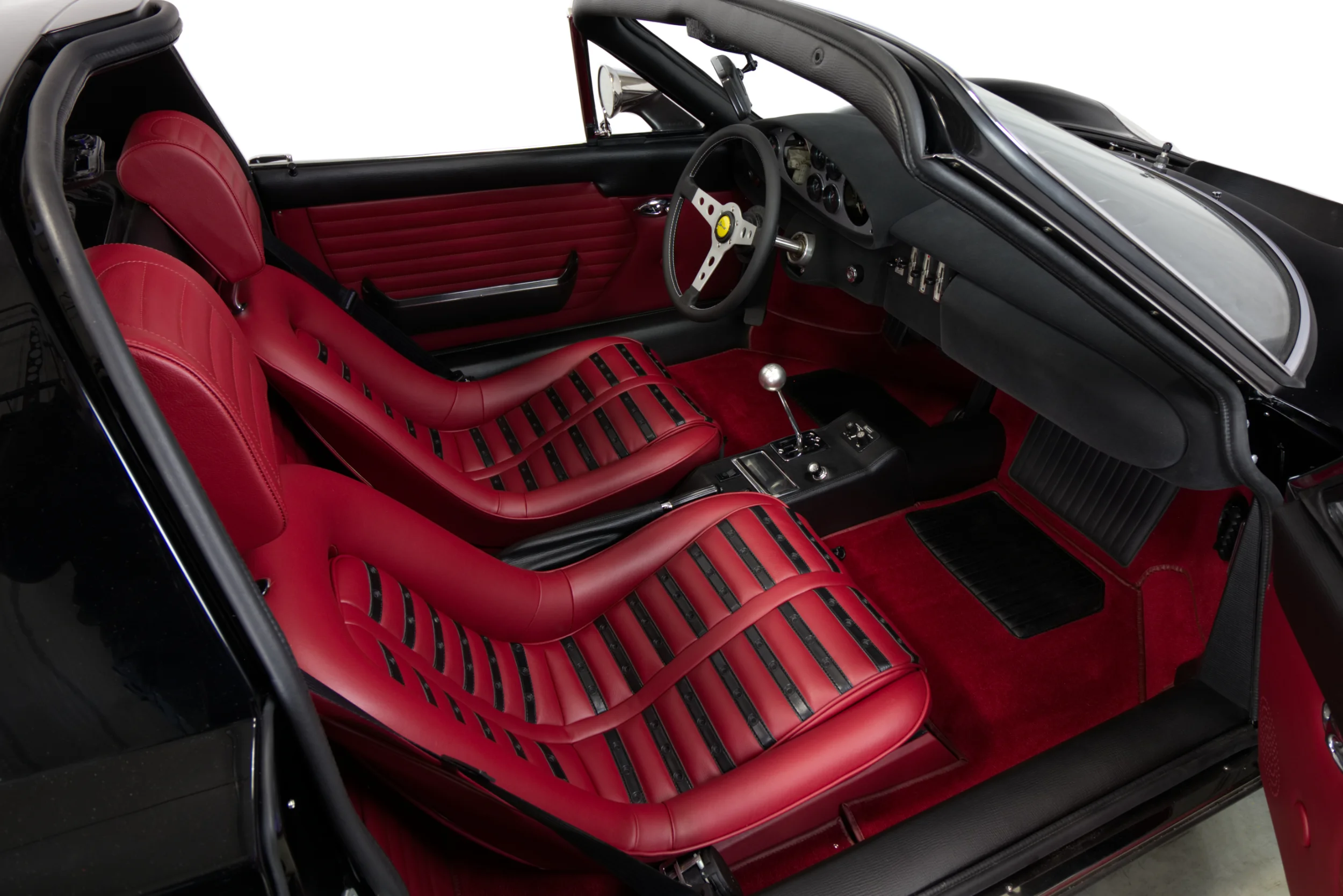 Stunning red leather interior to “Chairs and Flares” specification. Photo by O’ROURKE COACHTRIMMERS