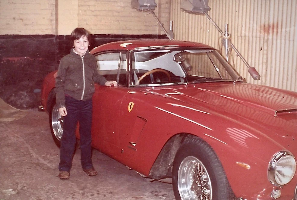 A young “Rorky” O’Rourke next to a Ferrari 250GT SWB in his dads workshop in the early 1980’s.