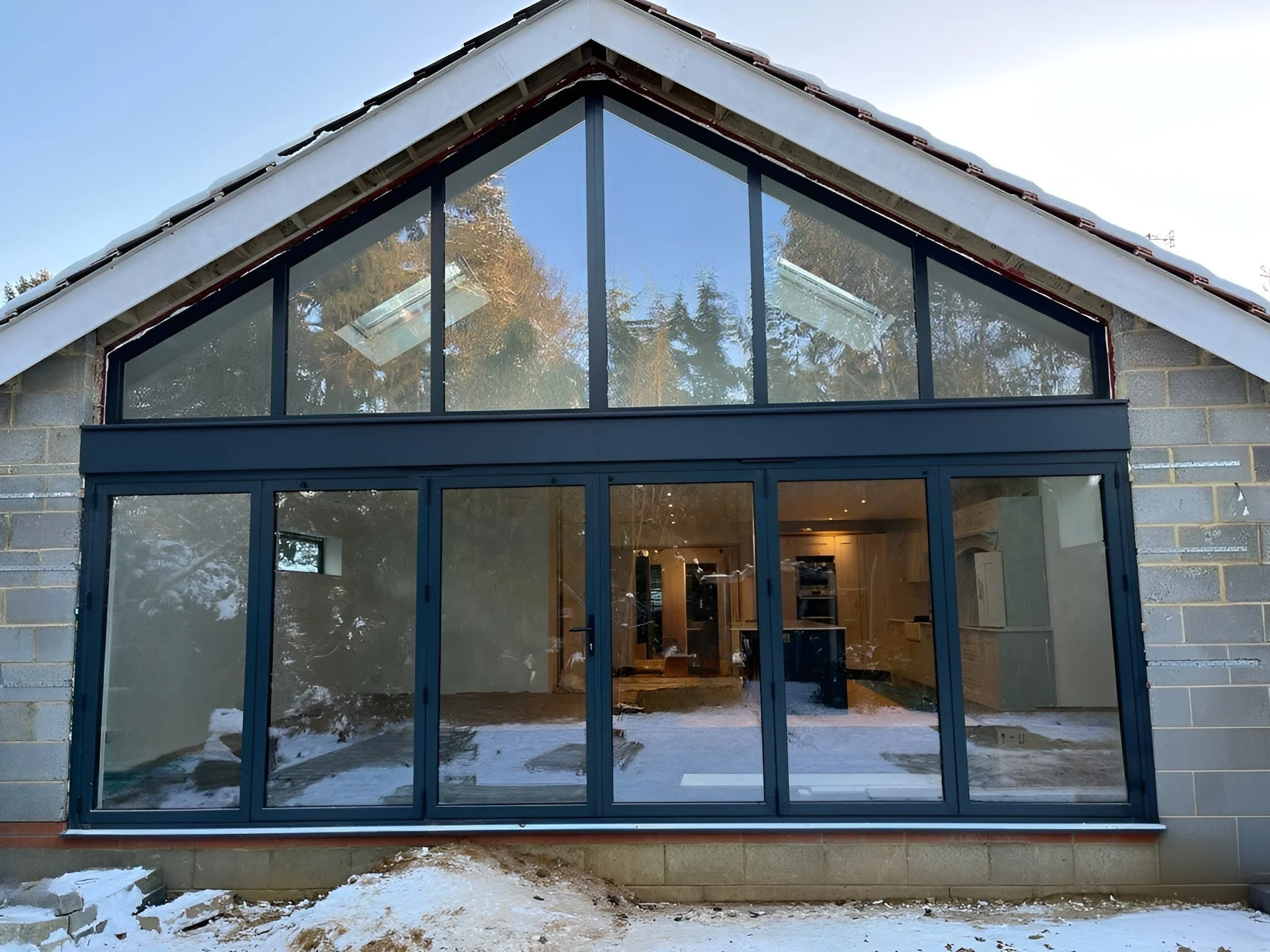 Large Gable end aluminium windows with bifolds in black 1.jpeg