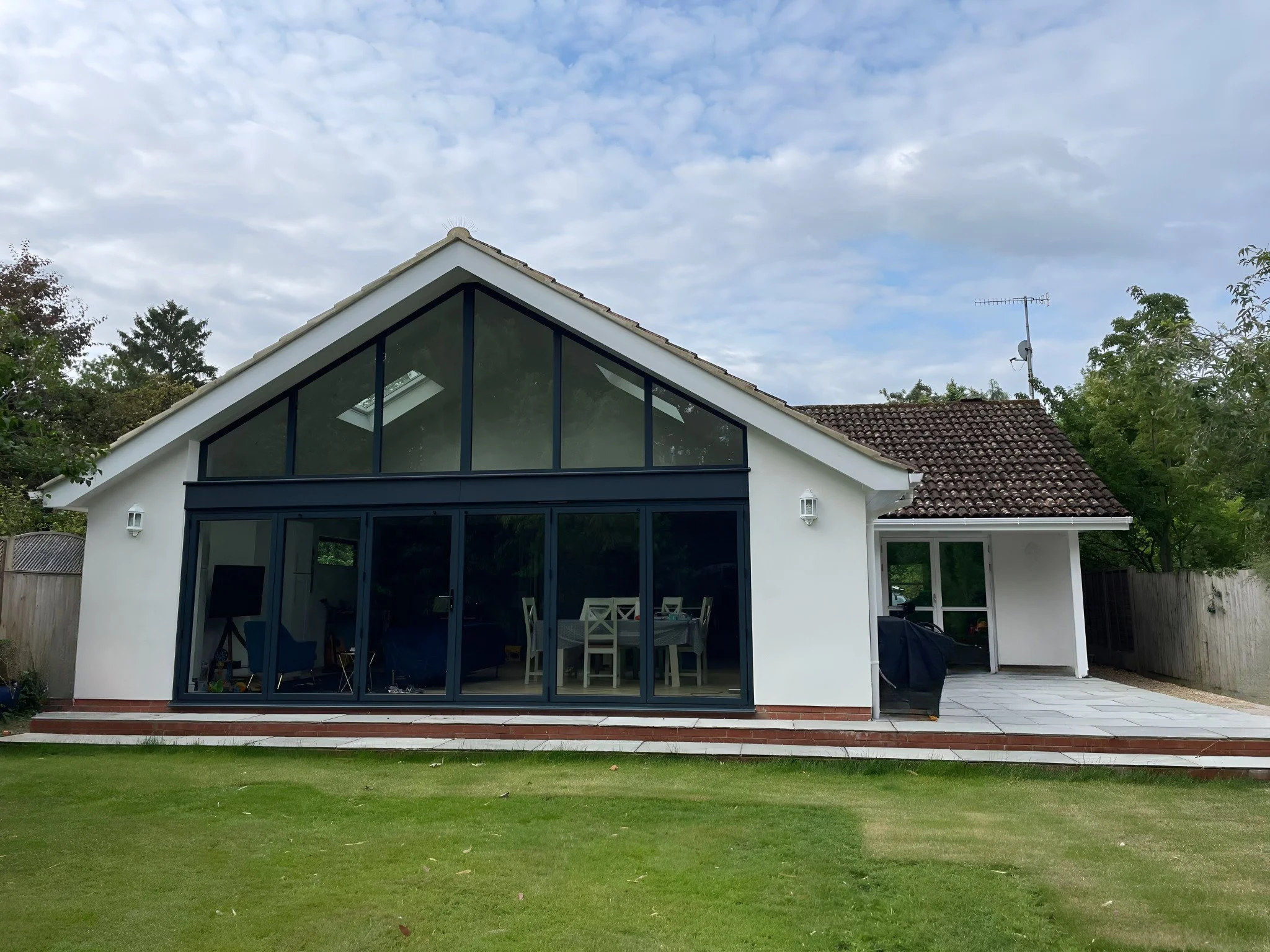 Large Gable end aluminium windows with bifolds in black.jpeg