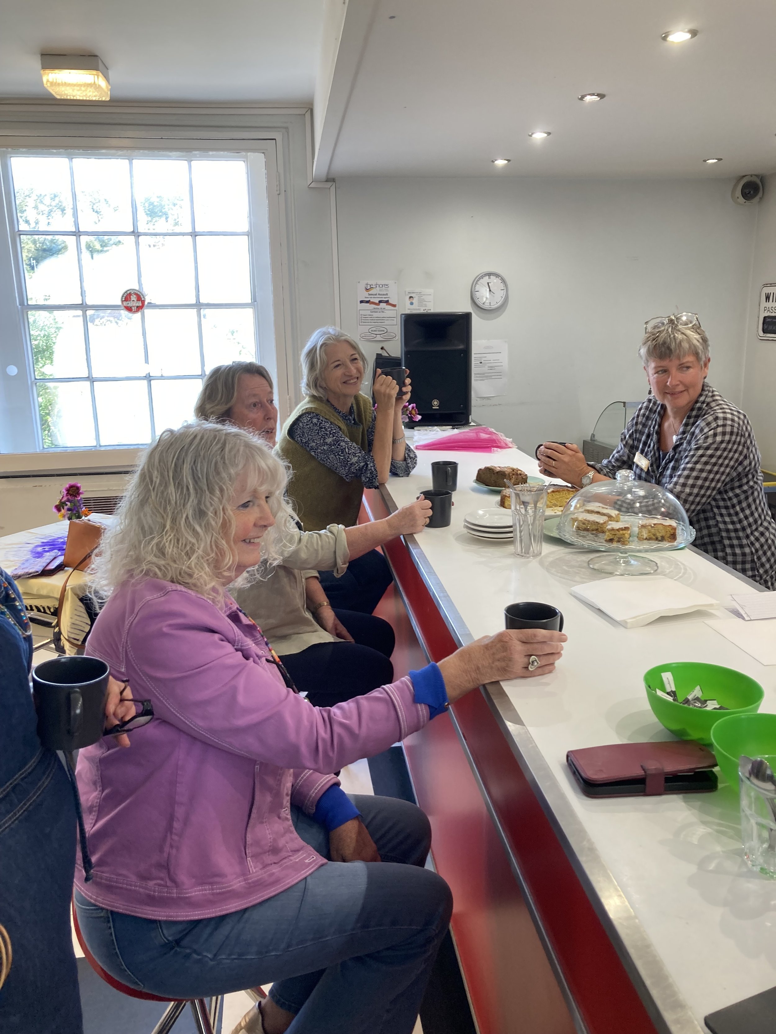 Cafe Create Attendees Enjoying a Drink, Cake and Chatting at Coffee Bar