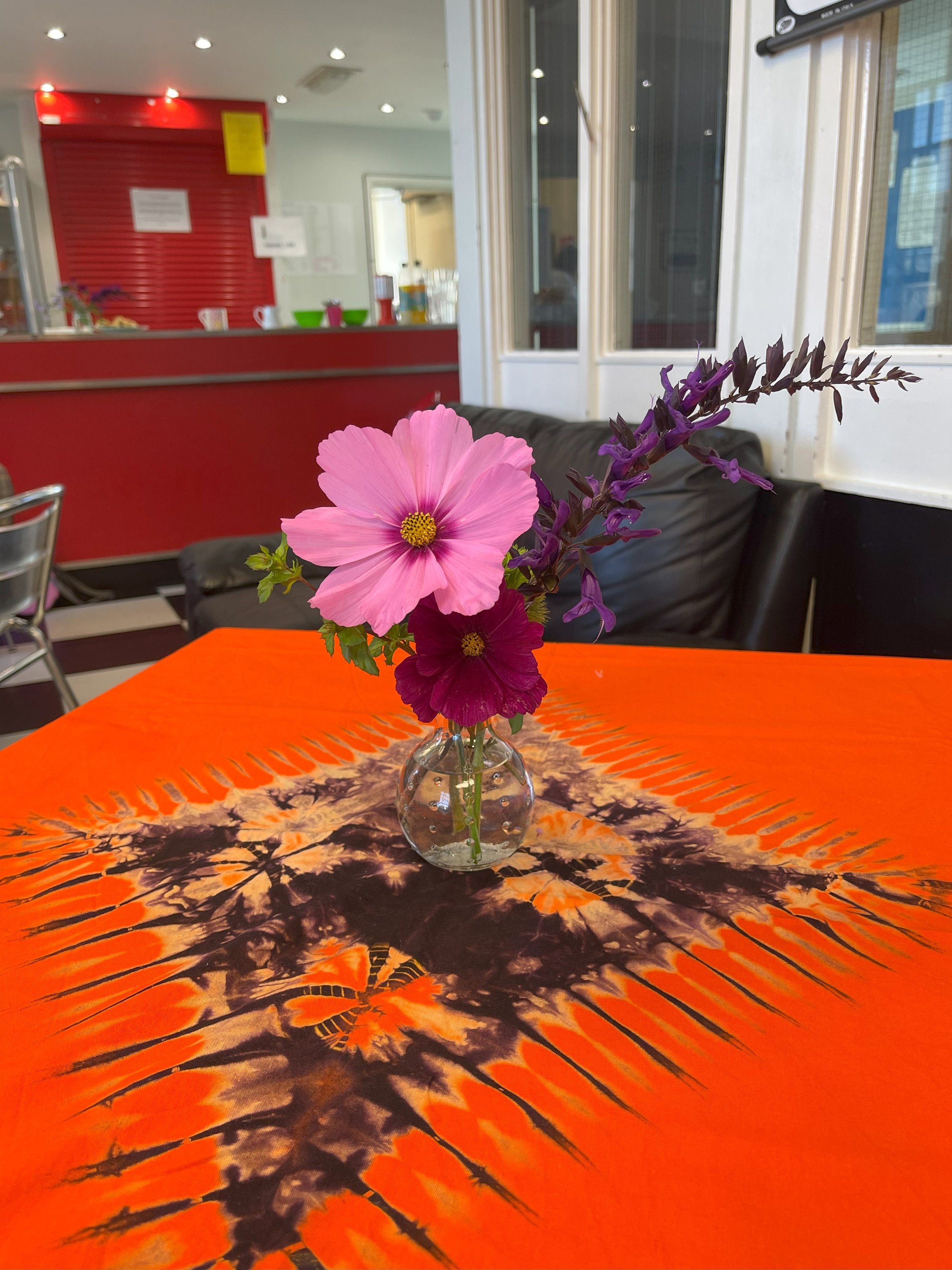 Pink Flower On Table At Cafe Create