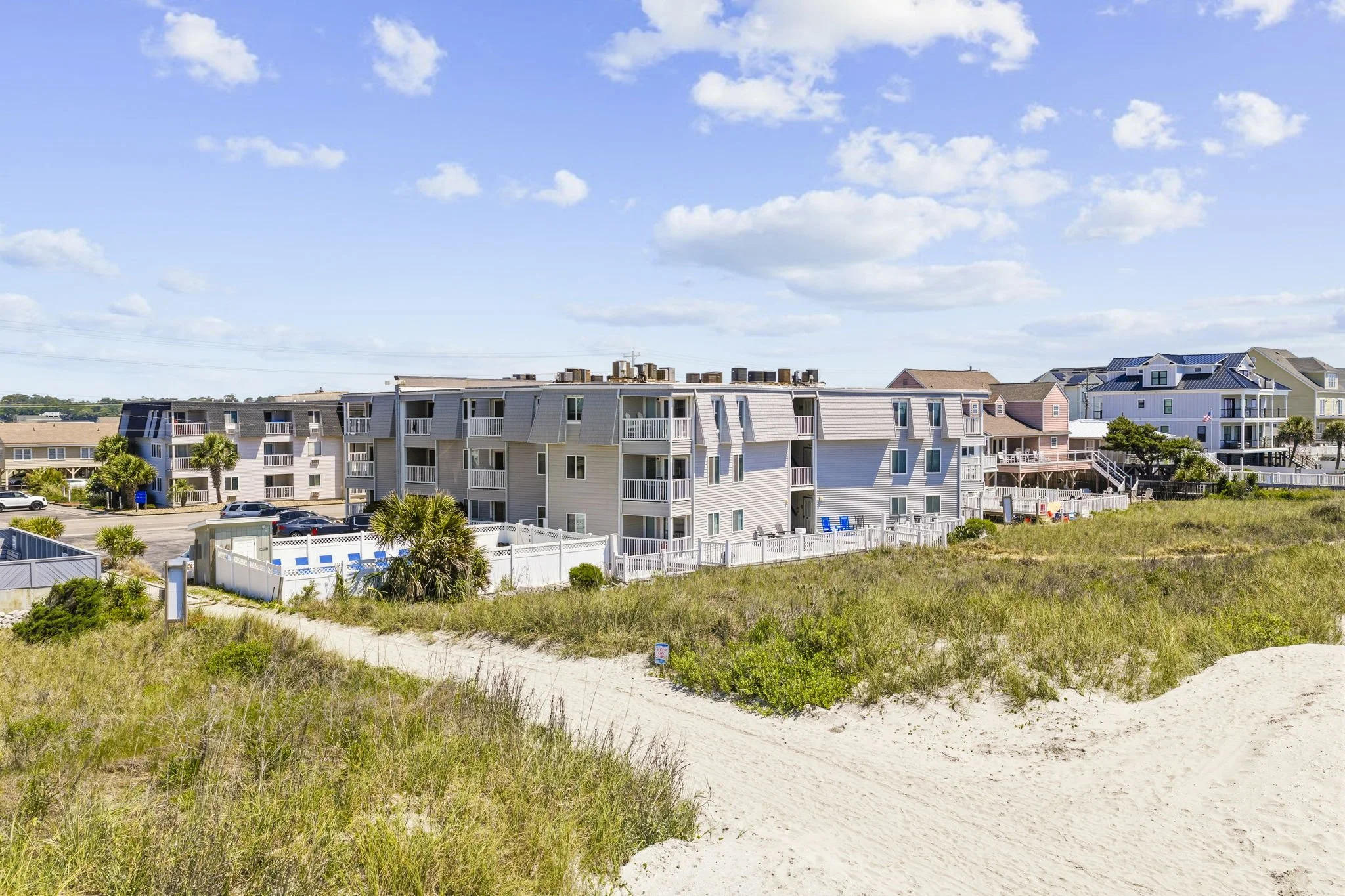 Located directly on the oceanfront in Cherry Grove, this beachfront condo complex offers private beach access, a community pool, and peaceful coastal surroundings just steps from the sand. Guests enjoy the perfect balance of quiet beachfront relaxati