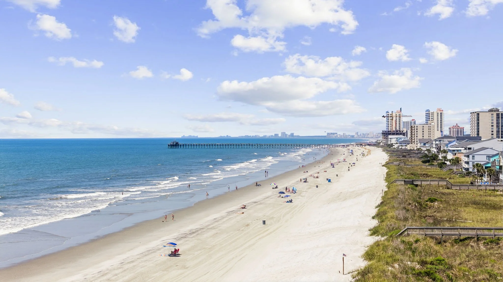 Enjoy breathtaking views of the Cherry Grove coastline and iconic pier from one of the widest, most peaceful stretches of beach on the Grand Strand. Whether you're taking a morning walk along the shore or relaxing in the sun, this oceanfront setting 