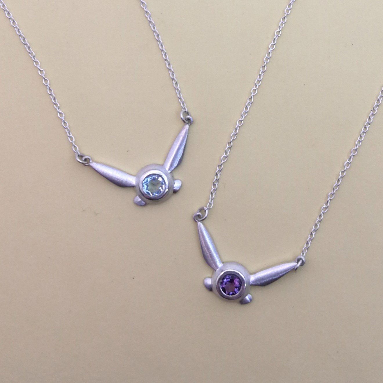 Navi Blue Topaz and Amethyst on yellow.jpg