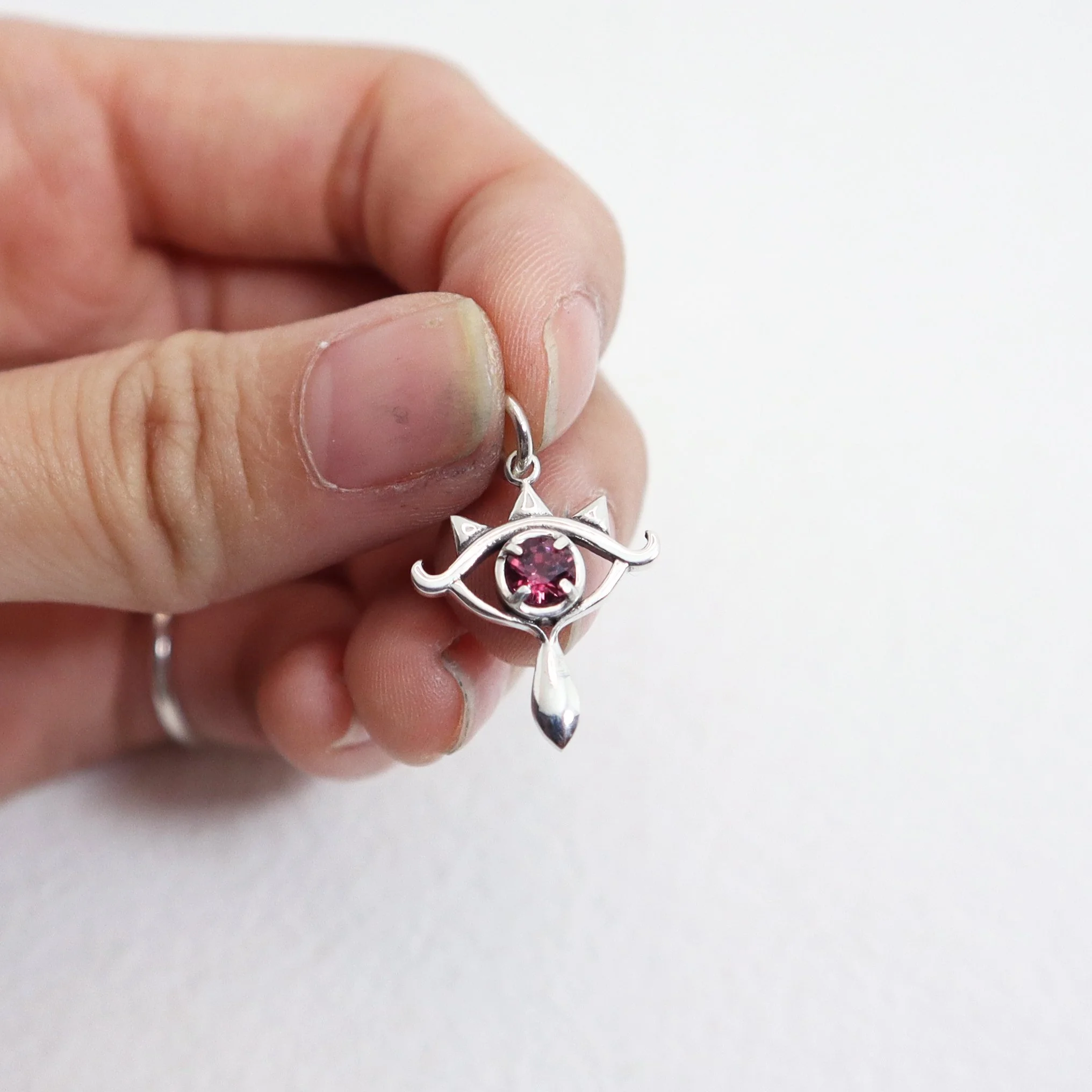 Lens of Truth w-Garnet - Hand Shot.jpg