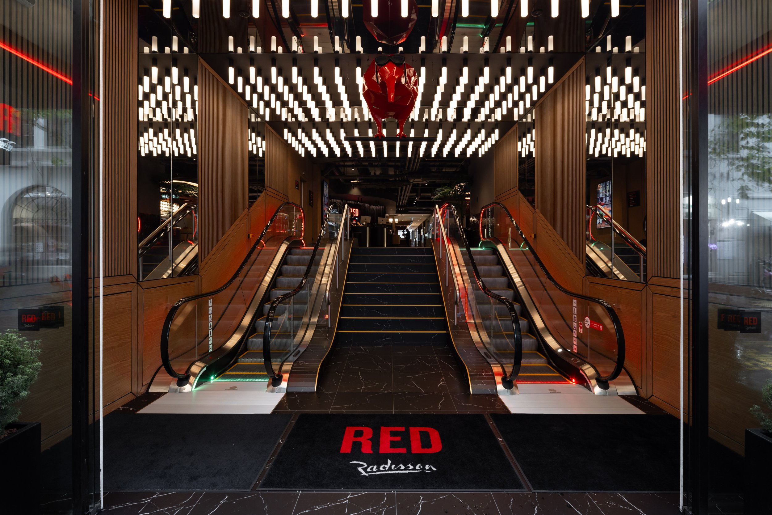   Radisson Red Auckland – "That's Theatre, Darling."  Positioned at the epicentre of Auckland's arts quarter, Y6 designed a highly choreographed hotel experience. As Radisson Hotel Group's first Radisson Red in Australasia, the bold, immersive design