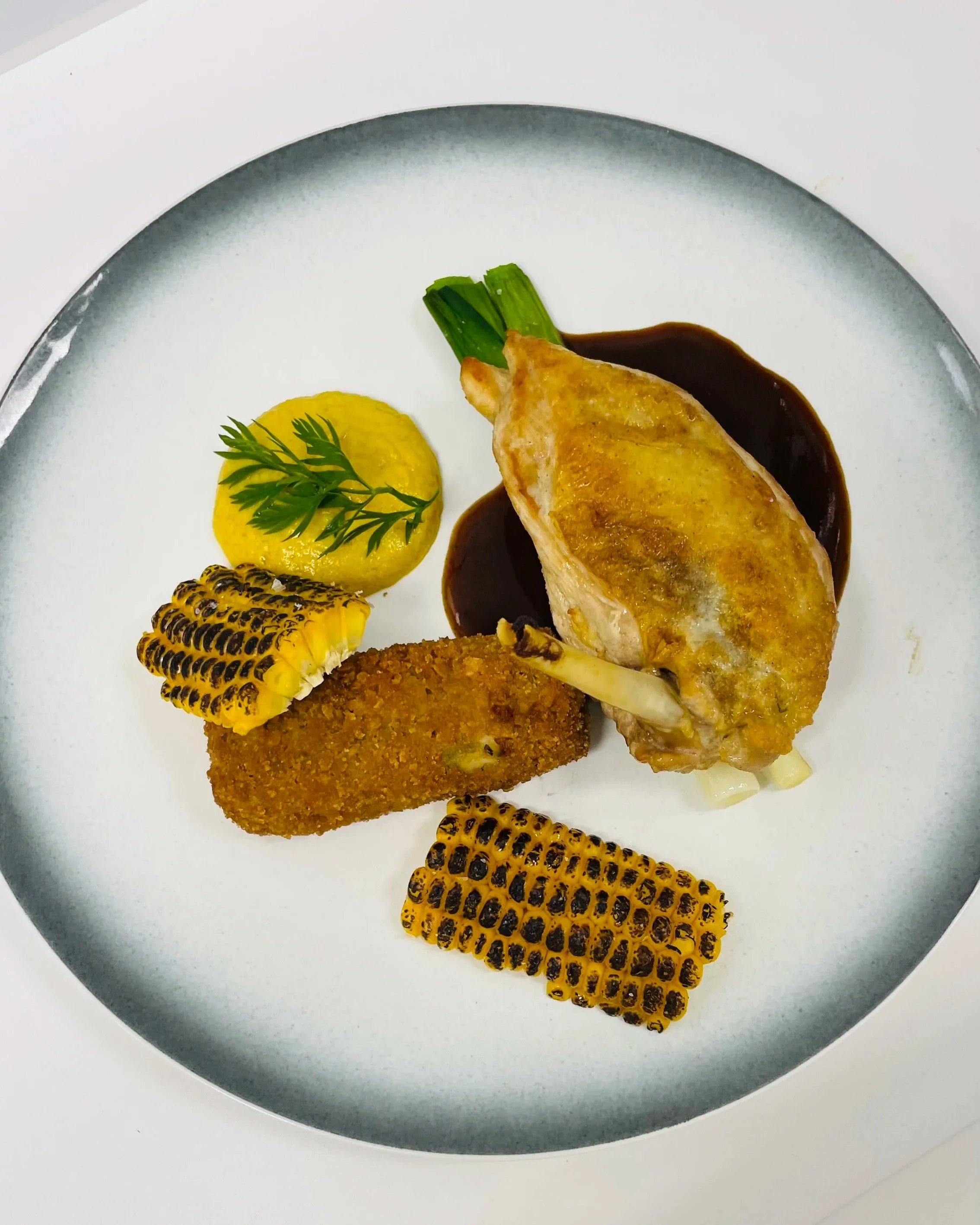 Guinea Fowl, sweetcorn plated on a contemporay plate