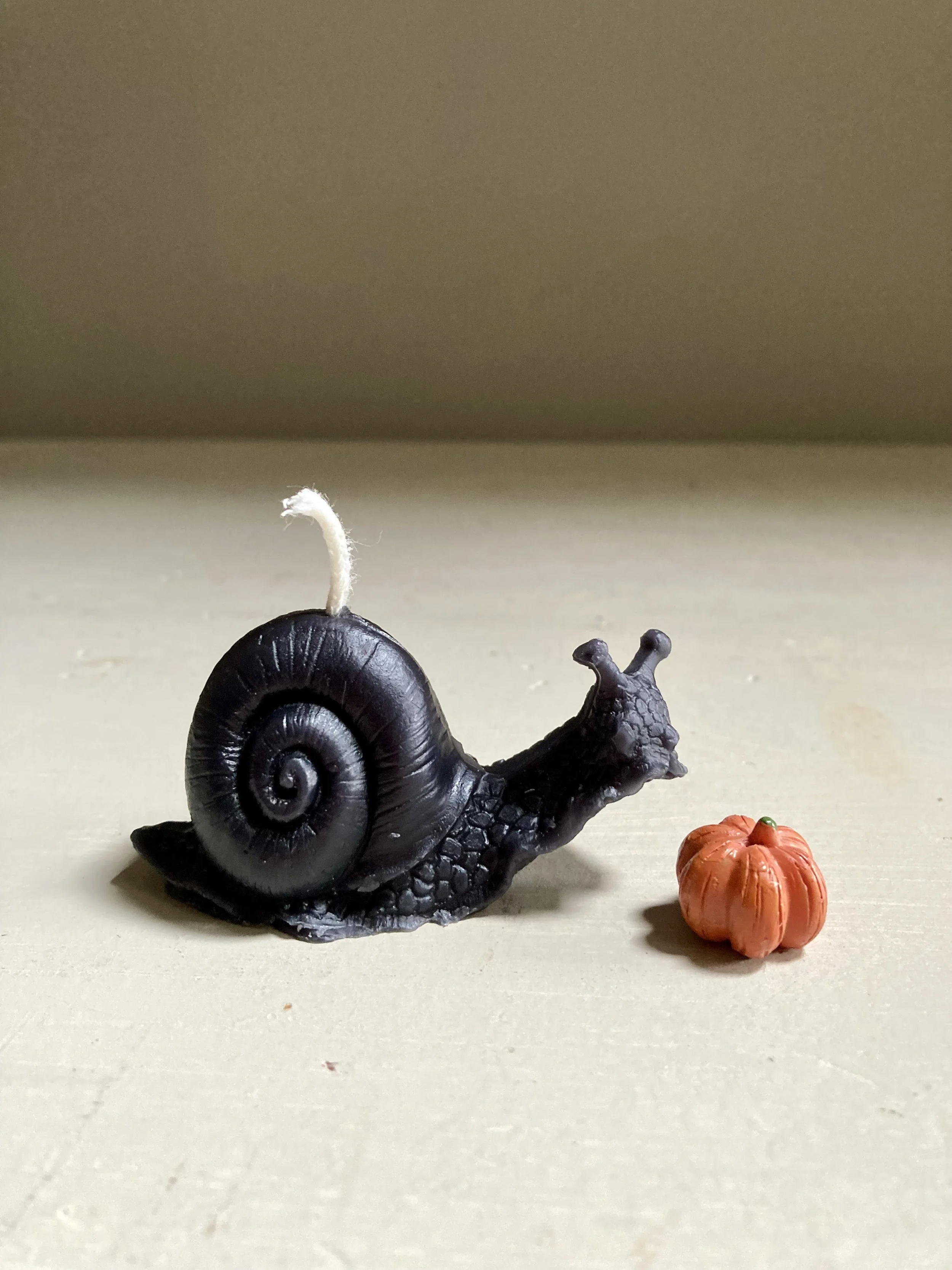 Black Beeswax Snail Candle, $10