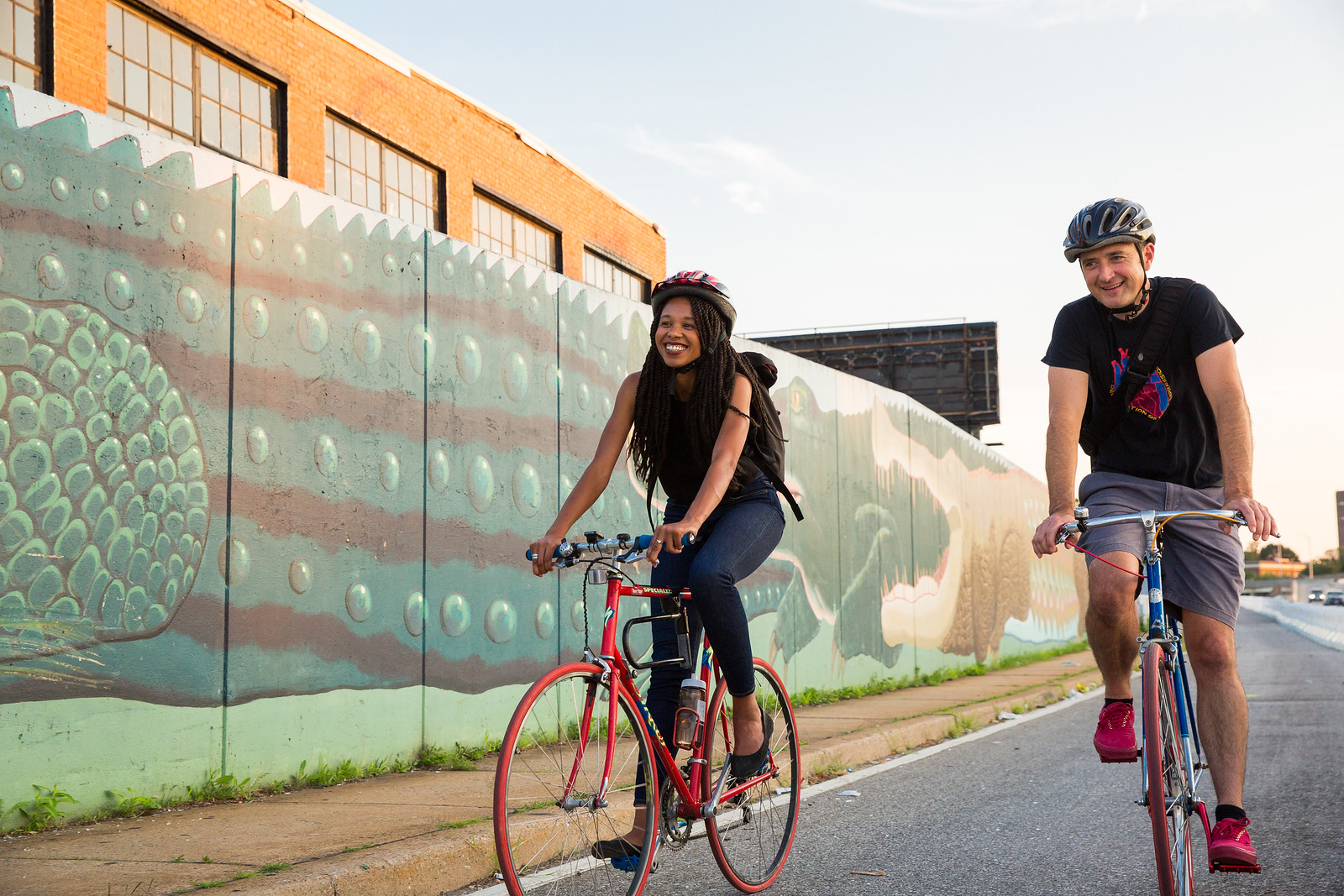 Man & woman biking in Baltimore
