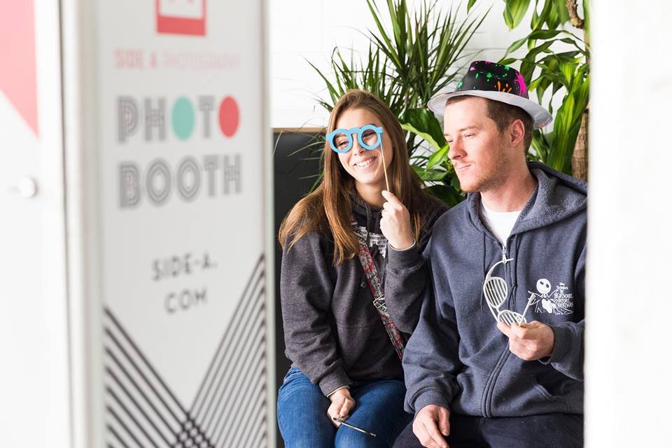 Smiling couple in the automatic/open-air booth
