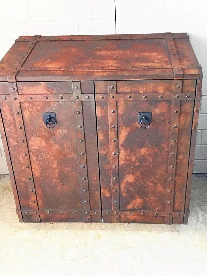 a cabinet covered in iron rust