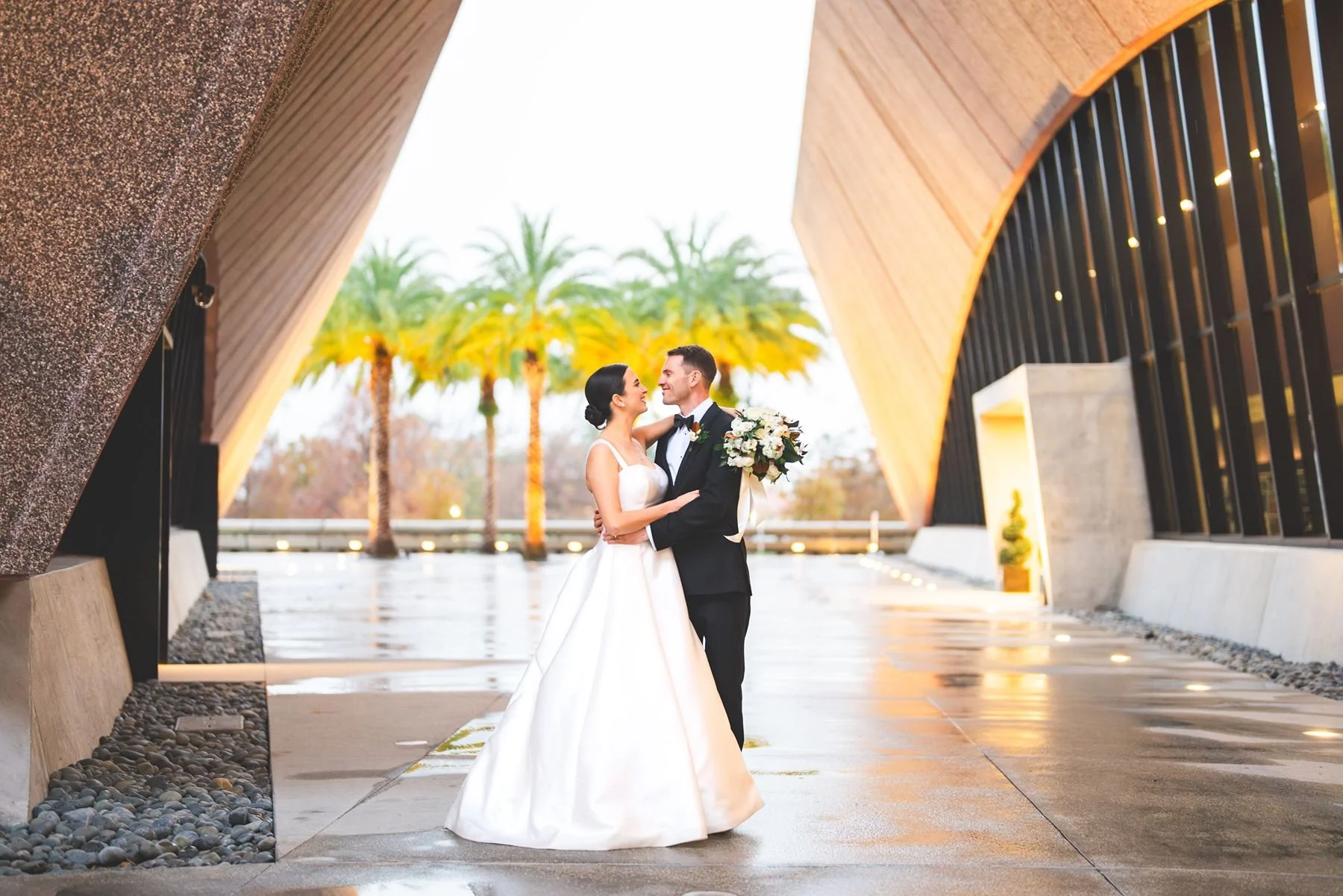 Bride and Groom at Winter Park Events Center on Rainy Wedding Day