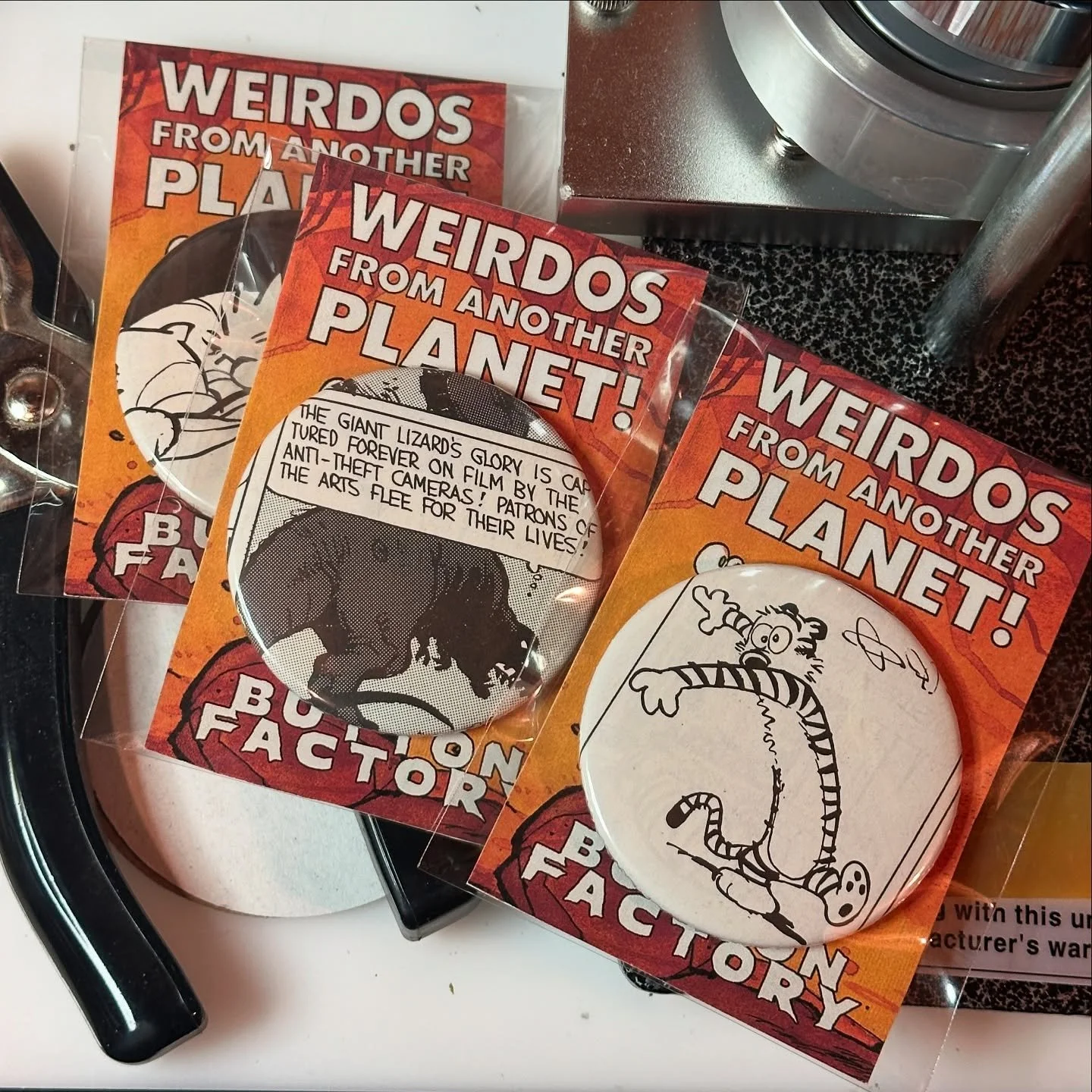 We are in the home stretch getting ready for @indiecomicscreatorcon The Button Factory is in full effect and will be debuting our #weirdosfromanotherplanet #calvinandhobbes #comicstrip #buttons.  Comics died so we could wear their tattered remains. ?