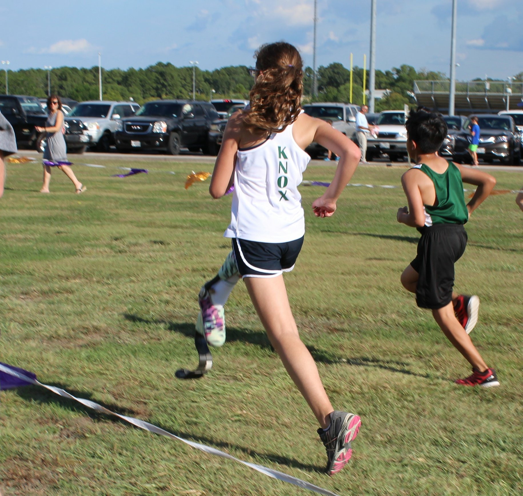  Elise running in a cross country meet, August 2018 