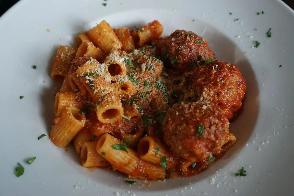 4oz  Meatballs over rigatoni, with the holy trinity 🙌 beef pork veal ground in house. Technically if you weigh 100 lbs, eat 4 of them and your body is now made of 1% meatball

What is the ideal meatball to body ratio 🤔 ?

#meatball #meatballs #past