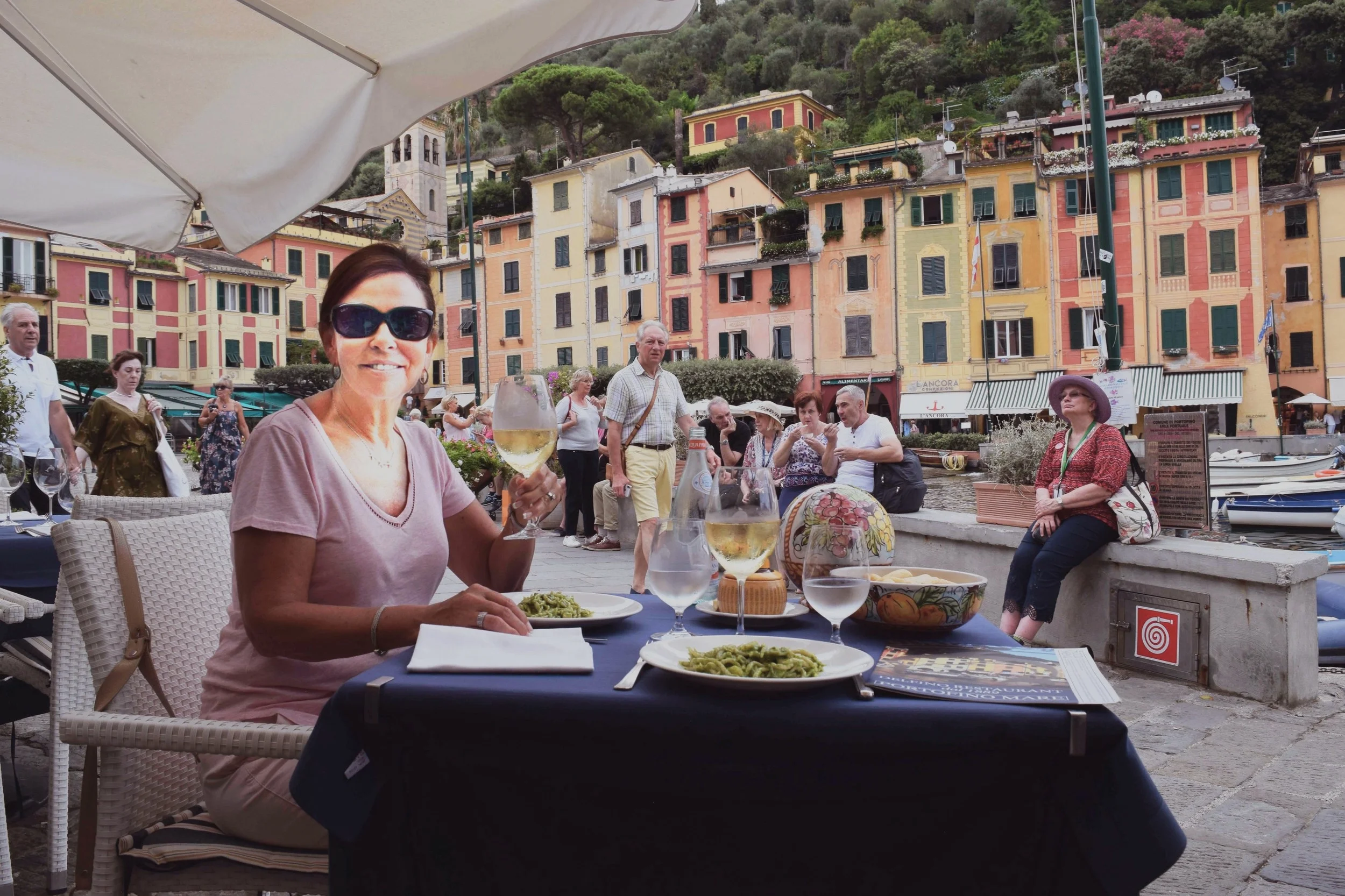 A lunch of trofietta pasta and Vermentino white wine at Delfino Restaurant in Portofino.