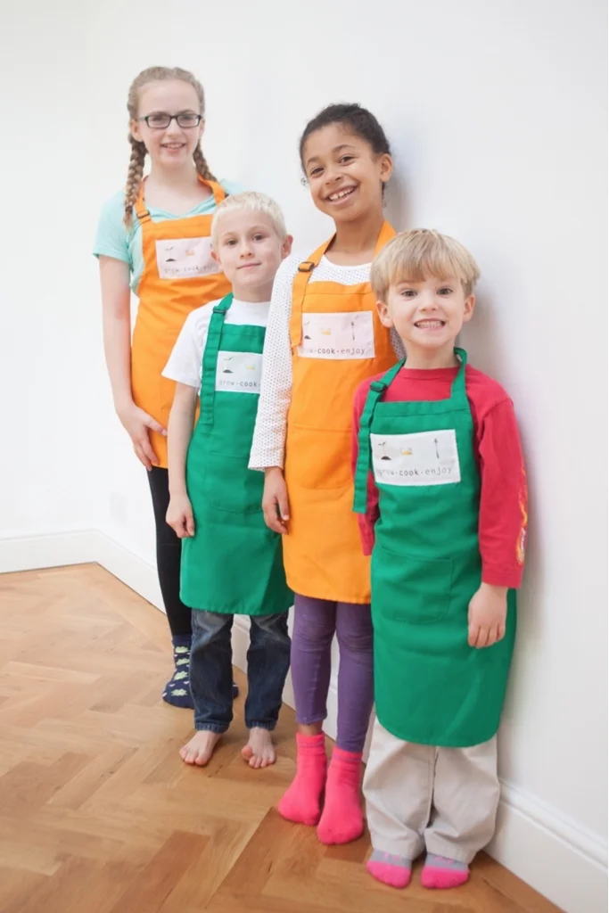 Children Standing in a line waiting to start a Grow Cook Enjoy class