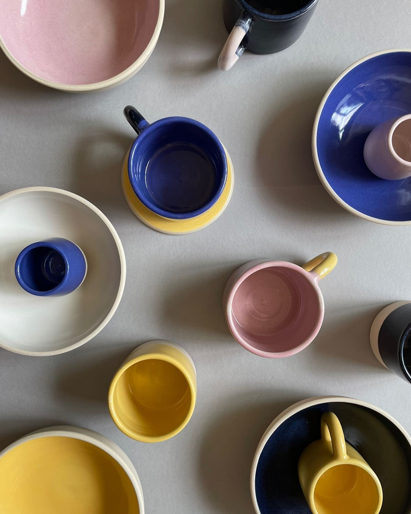 Arial view. Wheel thrown table stuff in stoneware and coloured glazes. Happy bank hols everyone 💛🌈
.
.
.
 #tableware #drinkware #cup #blue #yellow #foodie #decor #dinnerware #homedecor #giftideas #drinks #ceramic #finedining #homegoals #diningroom 