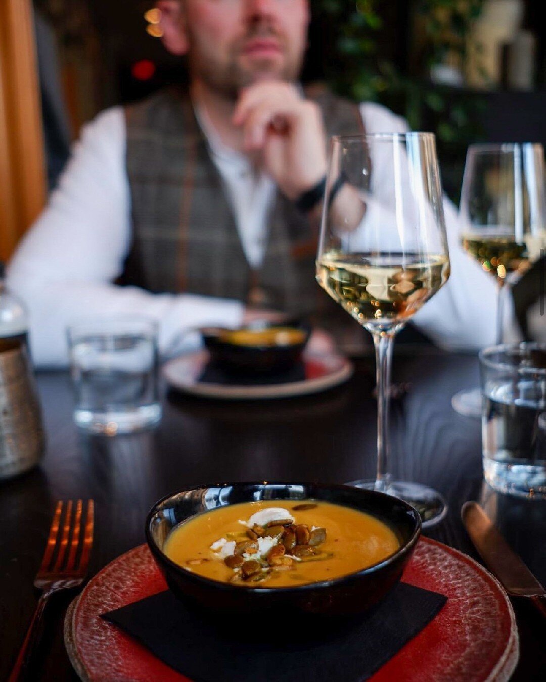 Cozy up with a bowl of our Butternut Squash Soup, made with the freshest local ingredients. The whipped ch&egrave;vre adds a tangy creaminess that perfectly balances the sweetness of the butternut squash, while the spiced pepitas and chive oil lend a