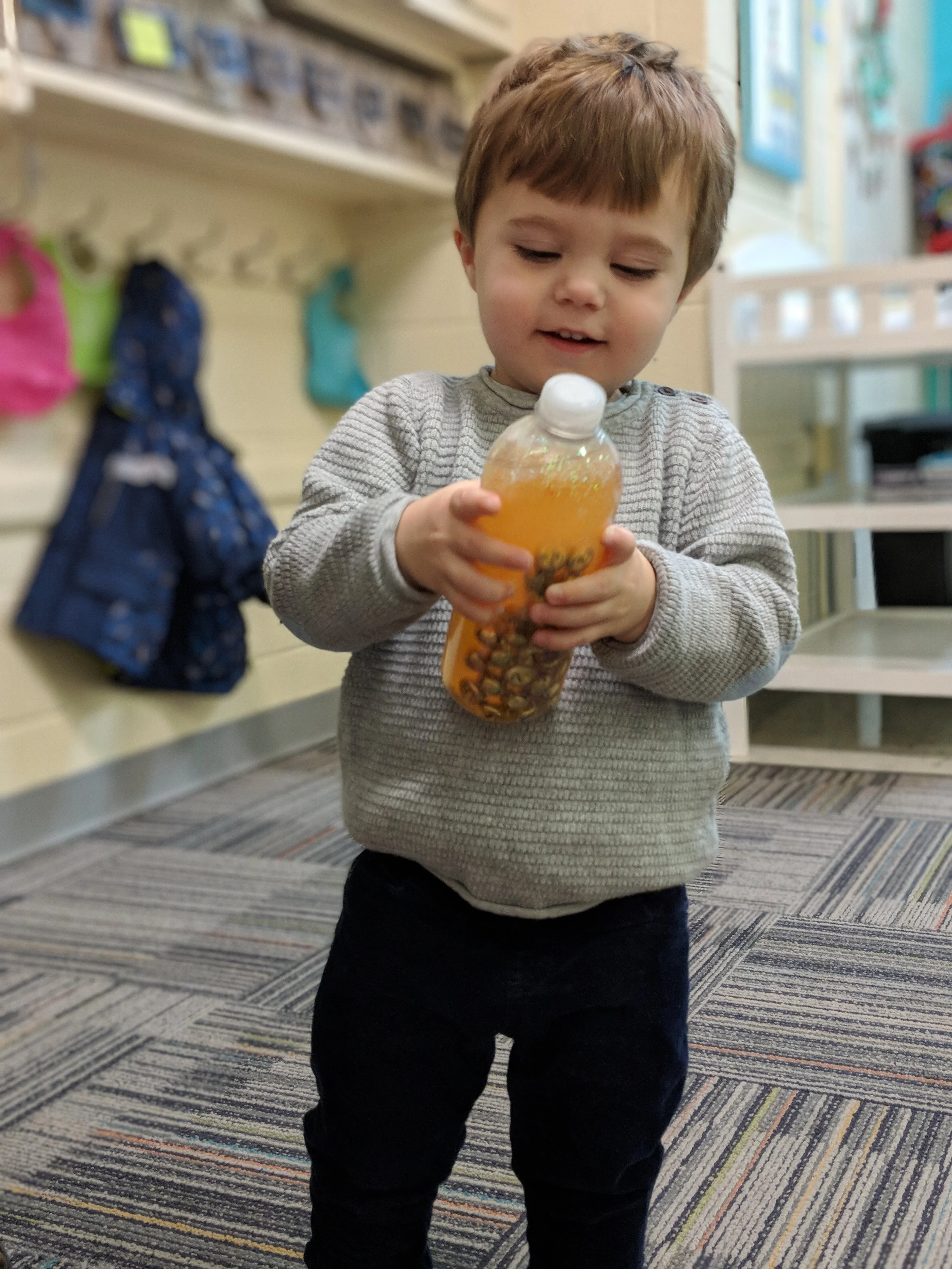 Playing with sensory bottles.jpg