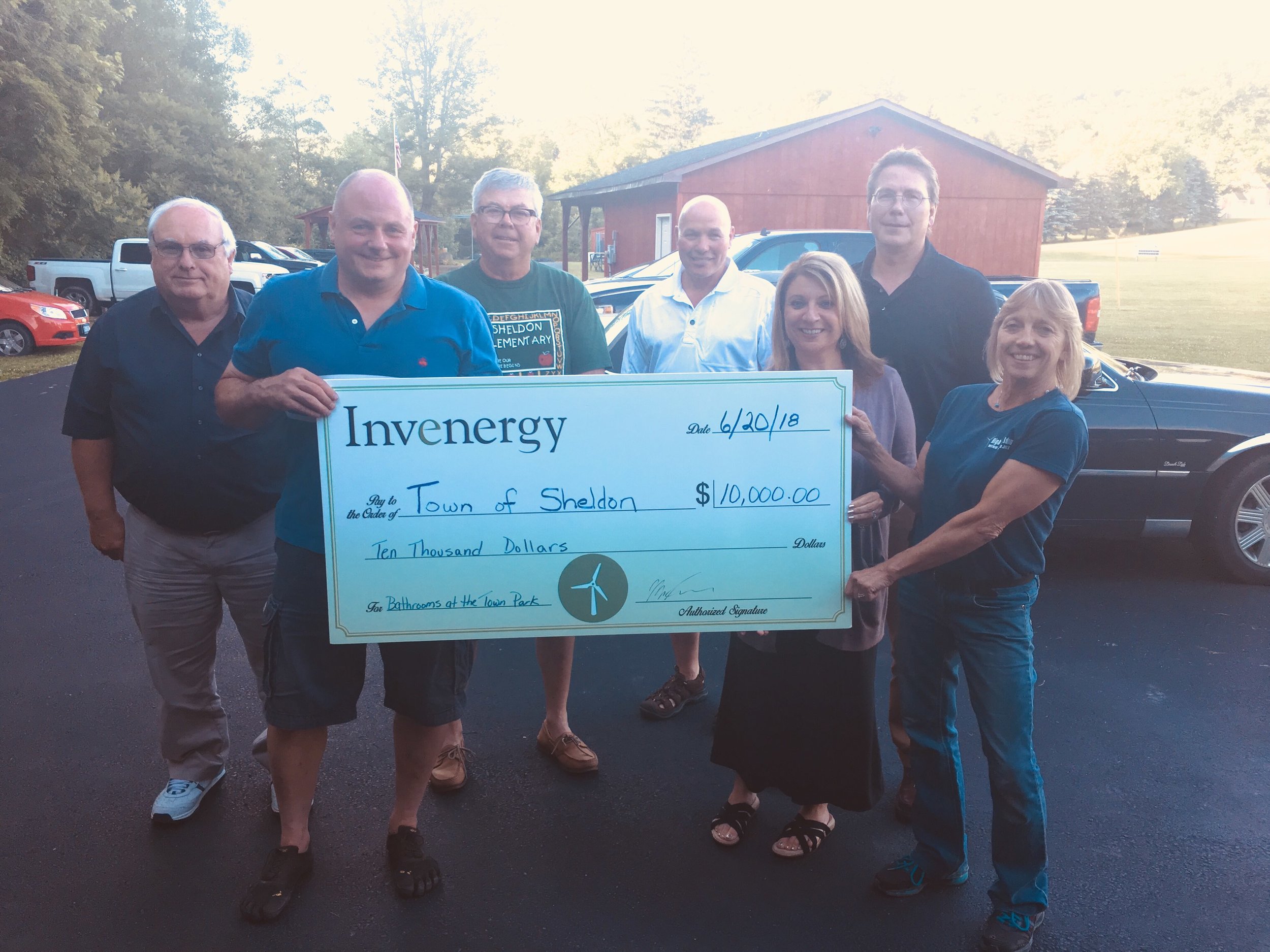 June 20, 2018: A check presentation from Invenergy to the Sheldon Town Board to pay for remodeled bathrooms for the town park. Invenergy donated $5,000 on behalf of Sheldon Wind Energy Center and $5,000 on behalf of Orangeville Wind Energy Center.