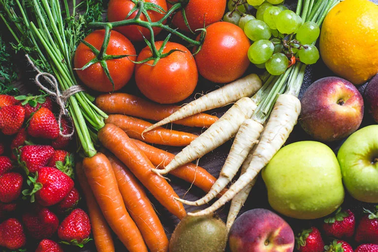 You may never have considered diet as a way to promote back health, but what you eat is most certainly an influence in whether or not your back is feeling up to par. Consuming enough nutrition – through back-health promoting vitamins and minerals – is crucial in the development, maintenance, and improvement of your bone, muscle, and disc health. Review this list of vitamins and minerals – whose back relief benefits we’ve highlighted – and find out where you can access these (easy, healthy recipes linked accordingly) to start promoting your best back, today! Vitamin A Vitamin A helps repair tissue and aids in the formation of bone. Examples of sources high in vitamin A include: beef liver, carrots, sweet potato , kale, spinach, broccoli To note: more than the recommended amount of vitamin A (about 900 mg daily for men and 700 mg daily for women) can promote bone fractures, so beware of excess intake. Vitamin B3 (Niacin) Vitamin B3, also referred to as Niacin, can help maintain a healthy nervous system, which is important for many spine conditions. Good sources: turkey, chicken breast, peanuts , mushrooms, lamb liver, tuna Vitamin B12 Vitamin B12 is crucial for healthy bone marrow and for the spine to grow and function. It reduces pressure in your back and eases chronic back pain. Good sources: clams , beef liver, mackerel, crab, tofu, bran cereal Vitamin C Vitamin C is necessary for the development of collagen, which allows cells to be able to form into tissue. It is important in the healing process for injuries involving tendons, ligaments, discs, bones, wounds, and burns. It increases calcium absorption in the body to promote strong bones and protects your back from damaging free radicals. Good sources: oranges, red peppers, kale , brussels sprouts, broccoli, strawberries Vitamin D Vitamin D is important for the development of healthy bones, aiding in calcium absorption to help prevent osteoporosis. It produces new bone cells, decreases inflammation in the body, and can lessen spasms in the lower back. Good sources: sunlight, sardines, salmon , mackerel, tuna, soy milk Vitamin E Vitamin E can help alleviate lower back pain as a powerful antioxidant that fights off free radicals. It increases the antioxidant reaction in your body and reduces muscle pain and soreness by repairing damaged tissue. Good sources: almonds, spinach, sweet potato, avocado , wheat germ, sunflower seeds Vitamin K Vitamin K is needed for the bones to properly use calcium, which in turn aids in the strength of healthy bones. Good sources: dried basil, kale, onions, brussels sprouts , chili powder, asparagus Calcium Calcium is essential for bone health and building strong bones, helping to maintain the necessary level of bone mass and prevent osteoporosis. Good sources: watercress, mozzarella, milk, yogurt , bok choy, tofu Iron Iron aids in the production of myoglobin, an important element of healthy muscles needed to support the spine. Good sources: squash and pumpkin seeds , chicken liver, oysters, mussels, clams, nuts Magnesium Magnesium helps maintain muscle tone and bone density, which can aid in the prevention of back problems. It is also a factor in prevention of calcium deficiency and osteoporosis. Good sources: raw spinach, squash and pumpkin seeds, mackerel, soy beans, brown rice, avocado Omega-3 fatty acids Omega-3 fatty acids can help inflammation that cause back pain. Good sources: cold pressed flaxseed oil, salmon , chia seeds, walnuts, caviar, mackerel Other sources that could be helpful… Devil’s Claw Devil’s Claw comes from a native African plant and can reduce flare-ups of chronic low back pain. The ingredients in this plant may be effective in reducing back pain , because it’s chemicals may decrease inflammation and swelling that cause the pain Capsaicin Capsaicin is the agent that gives hot peppers their heat, and this ingredient can be applied, using a cream, to relieve back pain . Turmeric Taken as a powder in capsules, mixed into tea, or as a liquid extract, Turmeric contains effective anti-inflammatory properties .