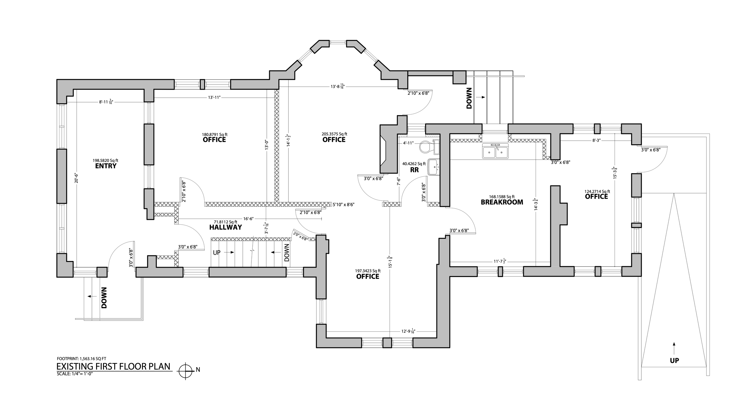 A detailed architectural floor plan of a building's first floor, including rooms like entry, hallways, offices, breakroom, restrooms, and stairs, with measurements and labels.