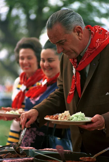 President Johnson getting some barbecue at Latin American Ambassadors Weekend on the ranch. LBJ Library photo by Yoichi Okamoto, Apr. 1, 1967