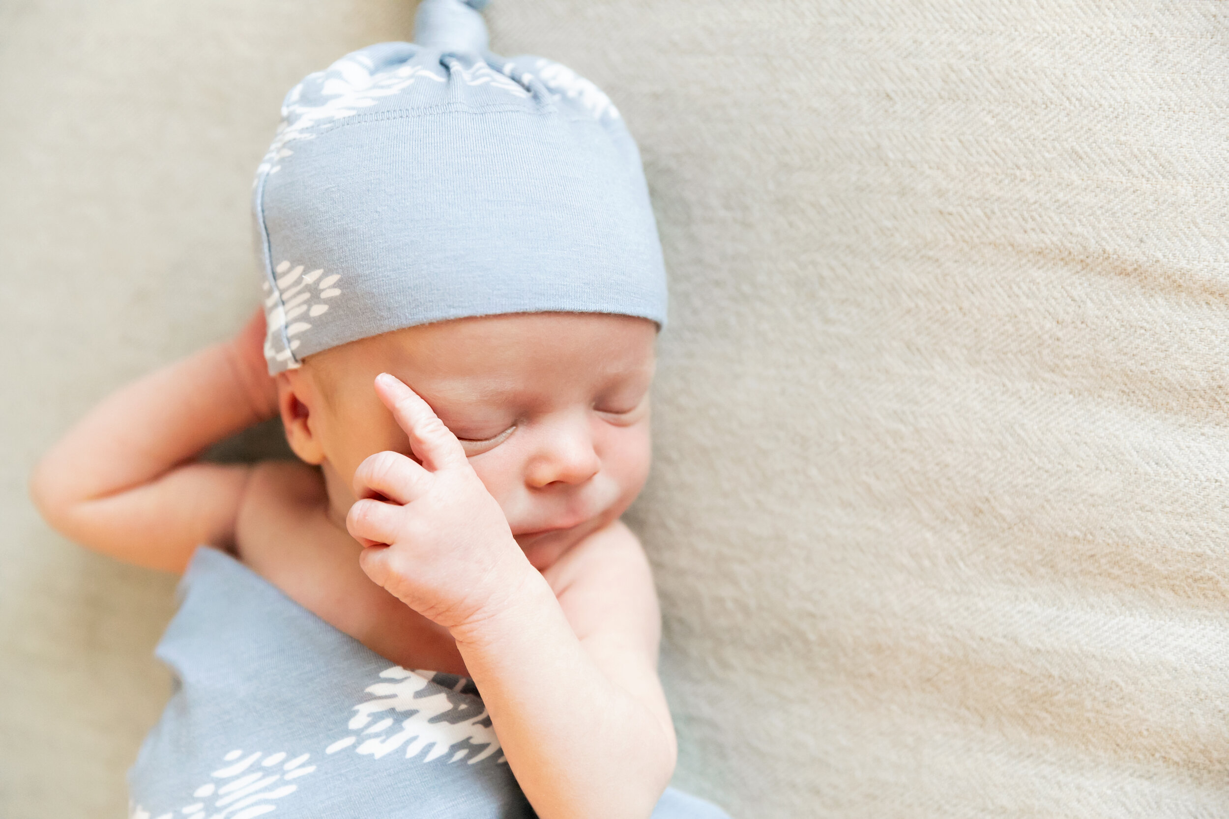 Minneapolis Newborn Baby Photography Sleeping Boy Blue Hat and Swaddle Lauren B. Photography 1.jpg