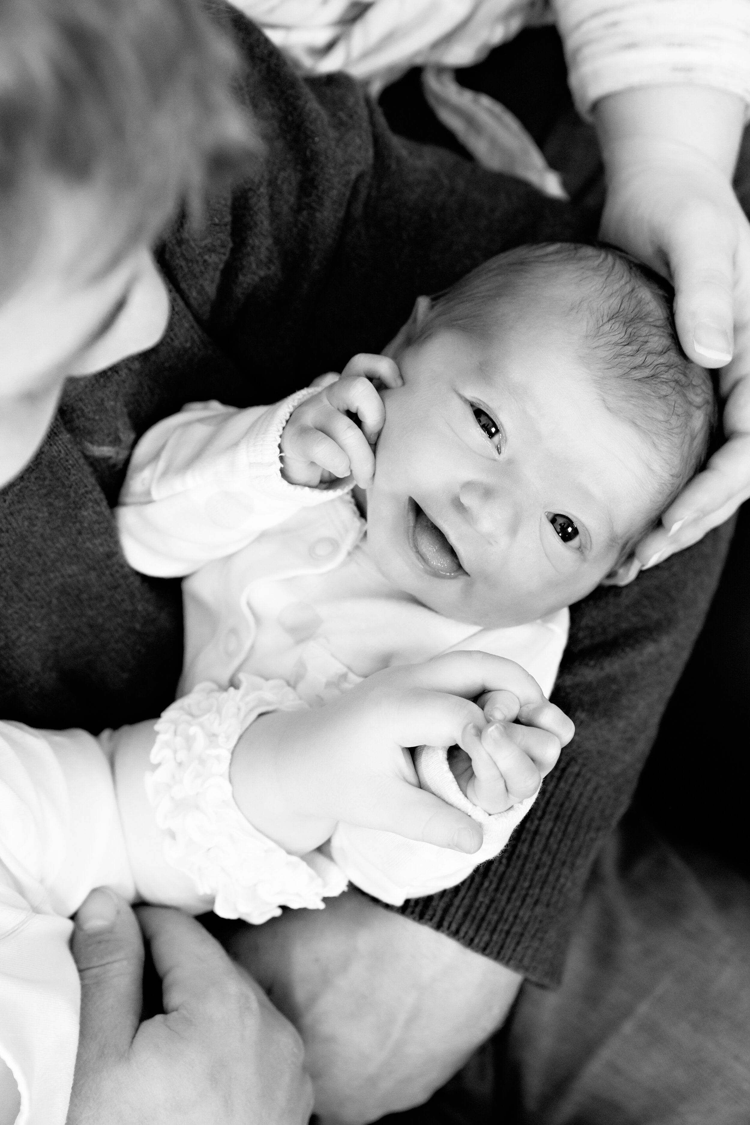Minneapolis Newborn Baby Photography Family Holding Smiling Girl Lauren B. Photography 6.jpg