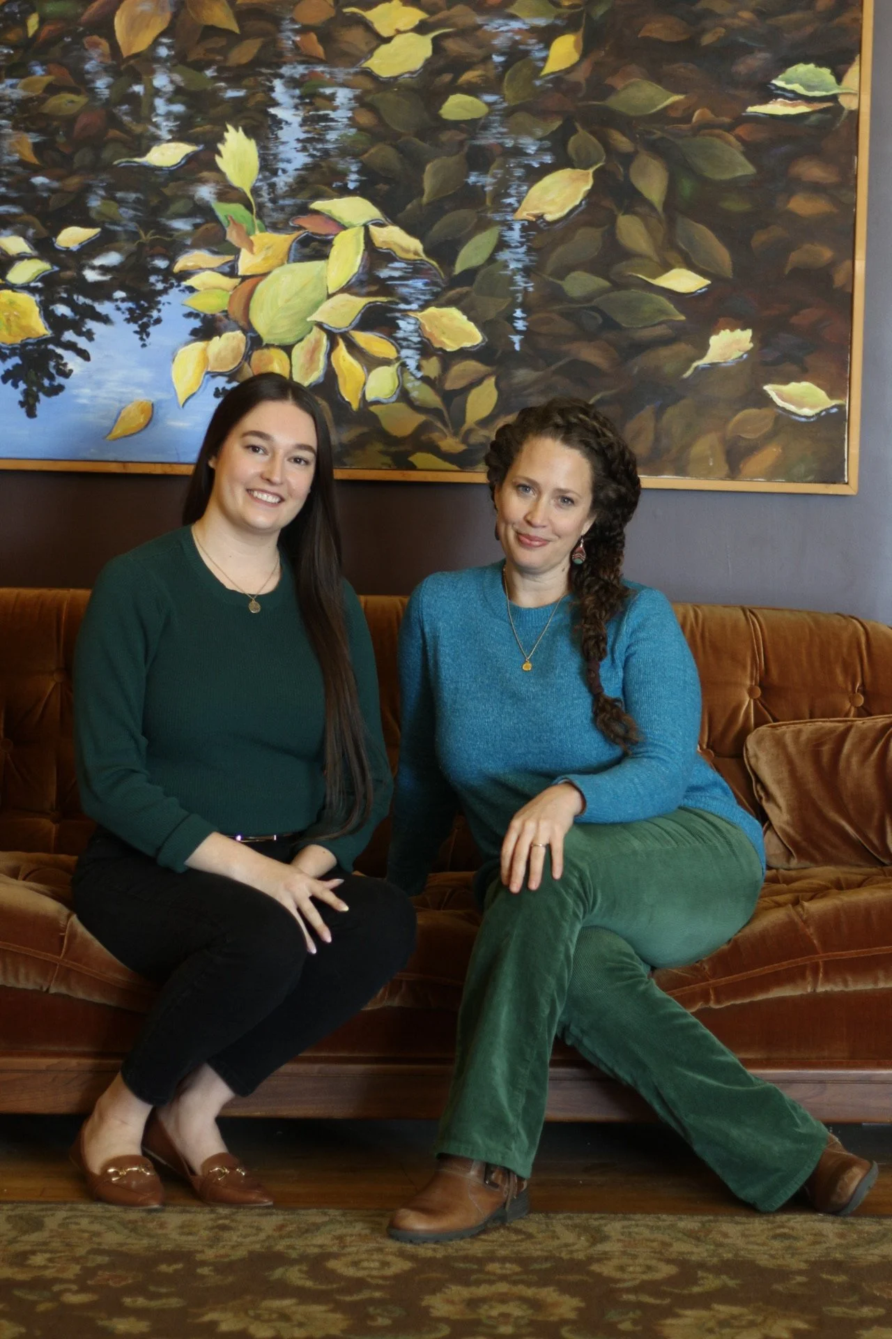 Megan and Amy sitting on couch.JPG