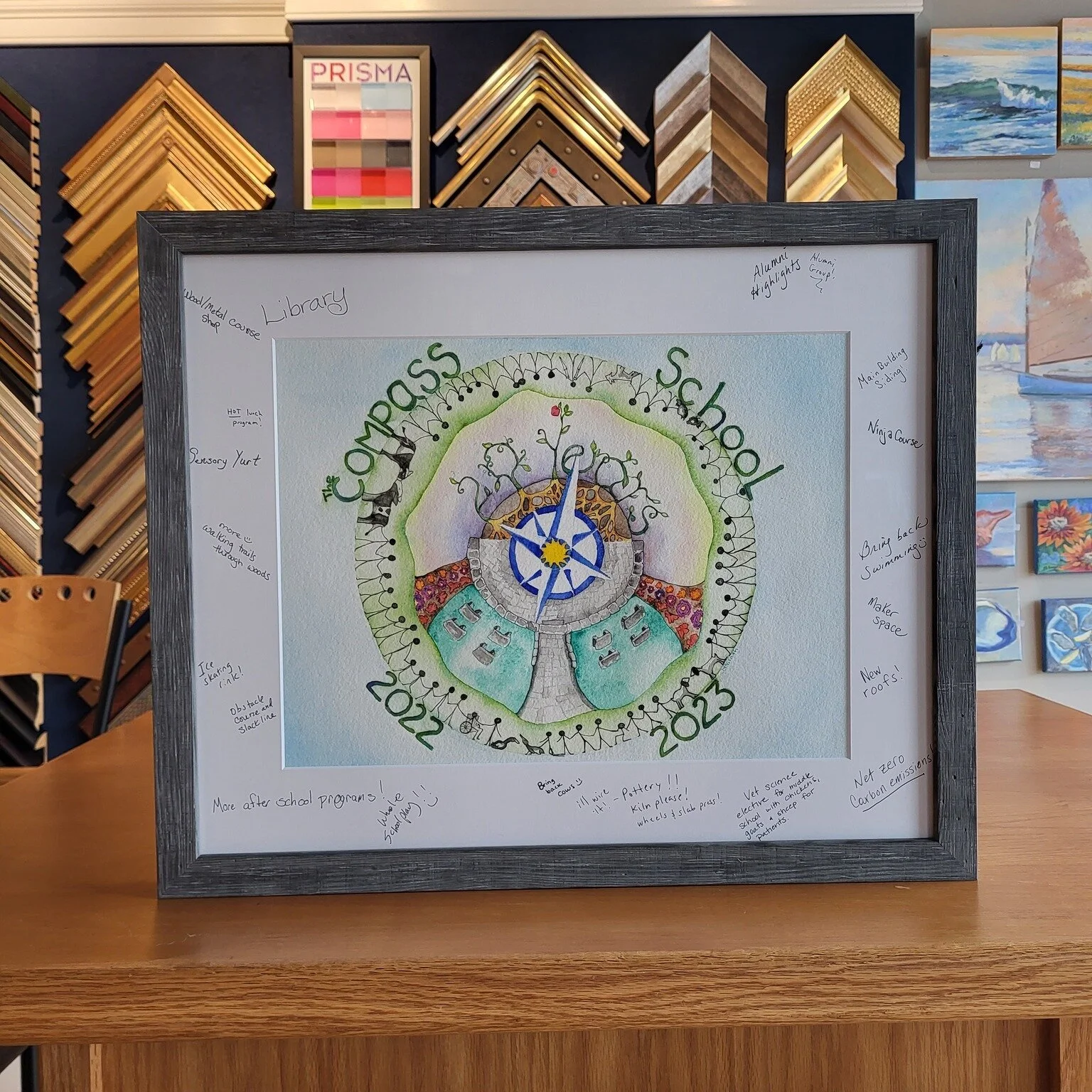 Congrats on the Compass School for their 20 year anniversary! We love collaborating with the school each year to frame their commemorative artwork. This natural wood grain frame is a good option for anyone wanting a unique frame; the grain is differe
