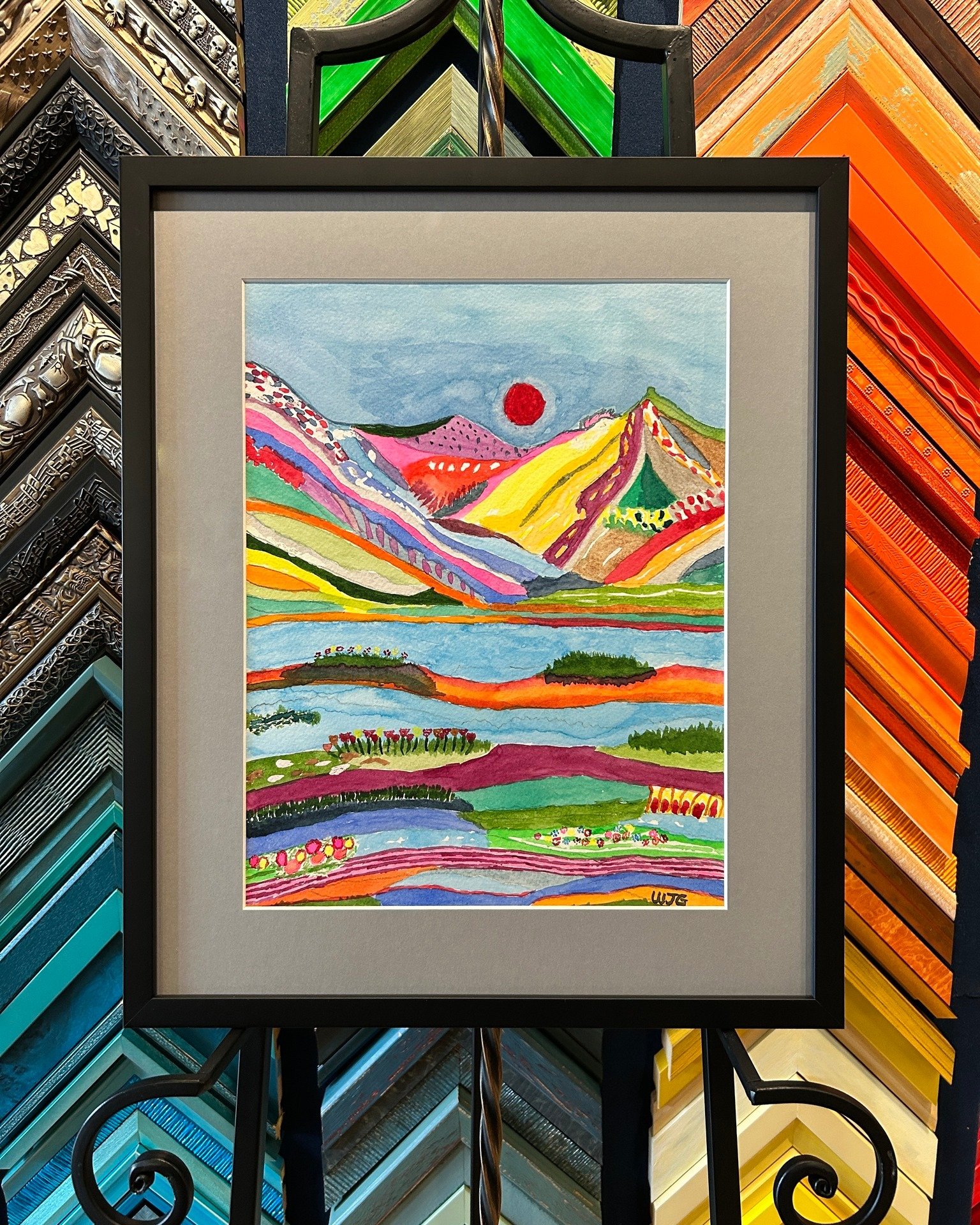 This colorful landscape was painted by our customer and local artist, William Gallogly, for his goddaughter. We just love the use of color and pattern to create this amazing landscape. Something with this much going on looks great in a simple black f