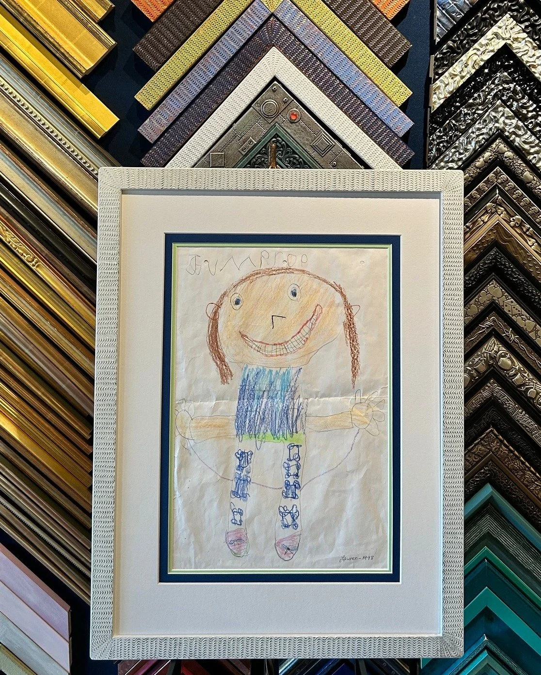 We are always a proponent of framing young artists work! We think this helps foster a sense of pride and creativity at a young critical age. This artwork is framed in a whimsical @spark_frames  frame with colorful mats to really make this artist feel