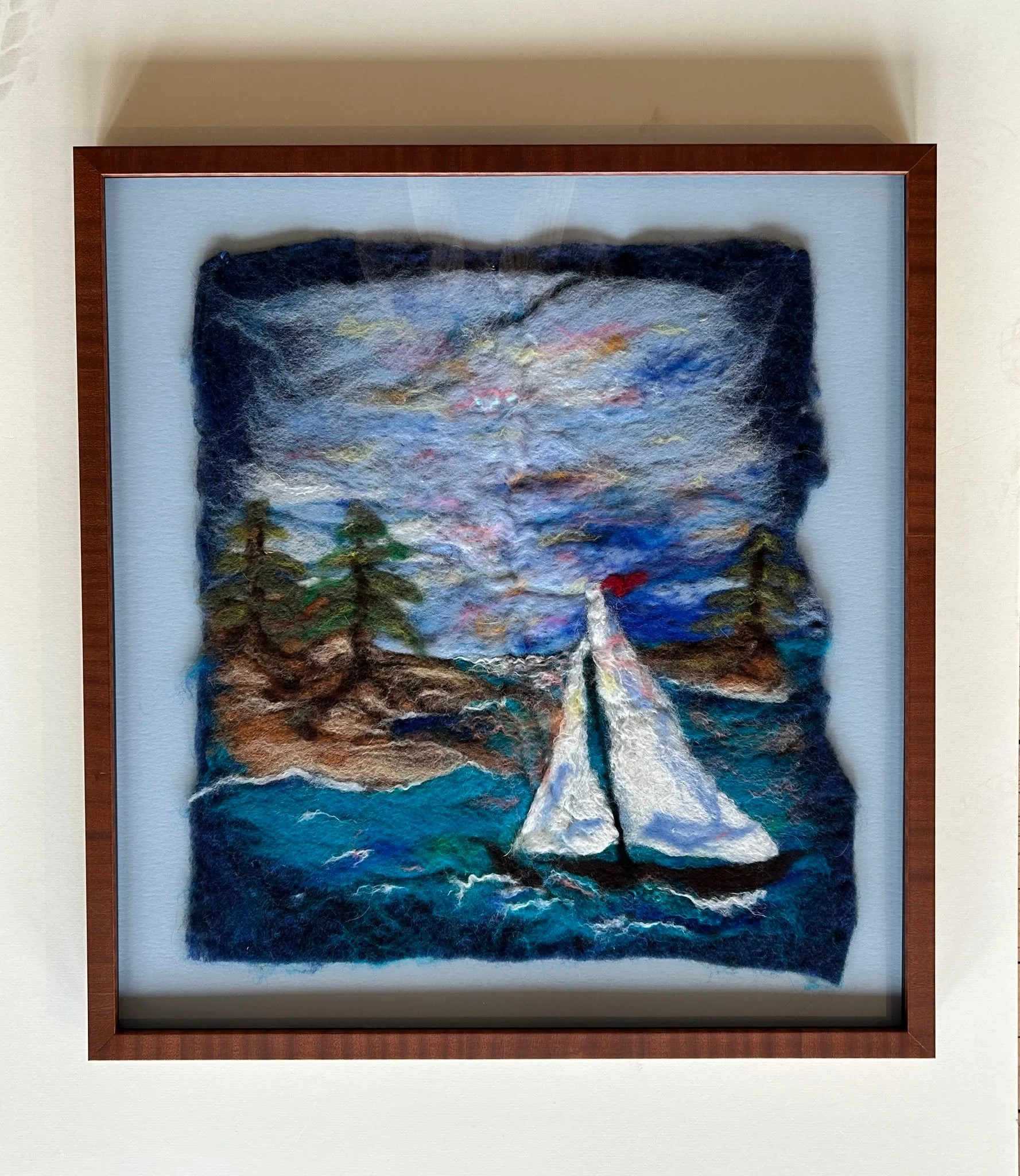 This felted artwork is beautifully top mounted, both to show off the raw edges and since it is a three dimensional piece that cannot be framed through traditional methods. Whatever you need framed, we promise we can come up with a creative way to fig