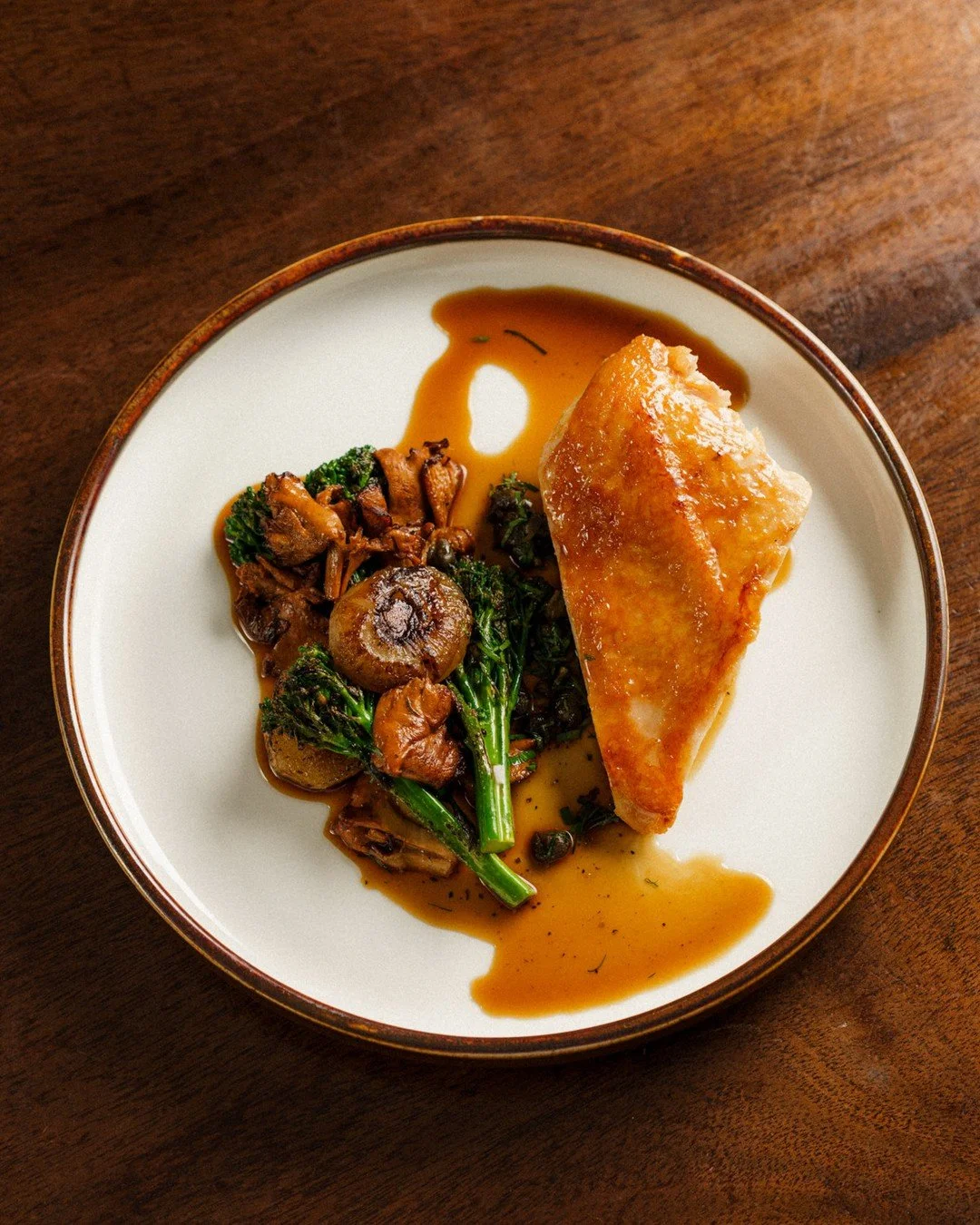 Supr&ecirc;mes de Poulet | roasted chicken breast, broccolini, chanterelle, cippolini, chicken jus⁠
⠀⁠
In French cooking, supr&ecirc;me refers to a boneless, skin-on breast. The name comes from the cut, not a claim about which part is best. Keeping t