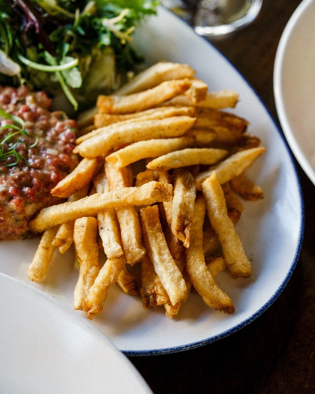 The fries everyone asks about.⁠
⠀⁠
Cut from whole potatoes in-house every day, double-fried for that perfect crisp and crunch. The exterior stays golden and crunchy, the inside stays fluffy, and there's a pleasant, lightly nutty flavour that comes th