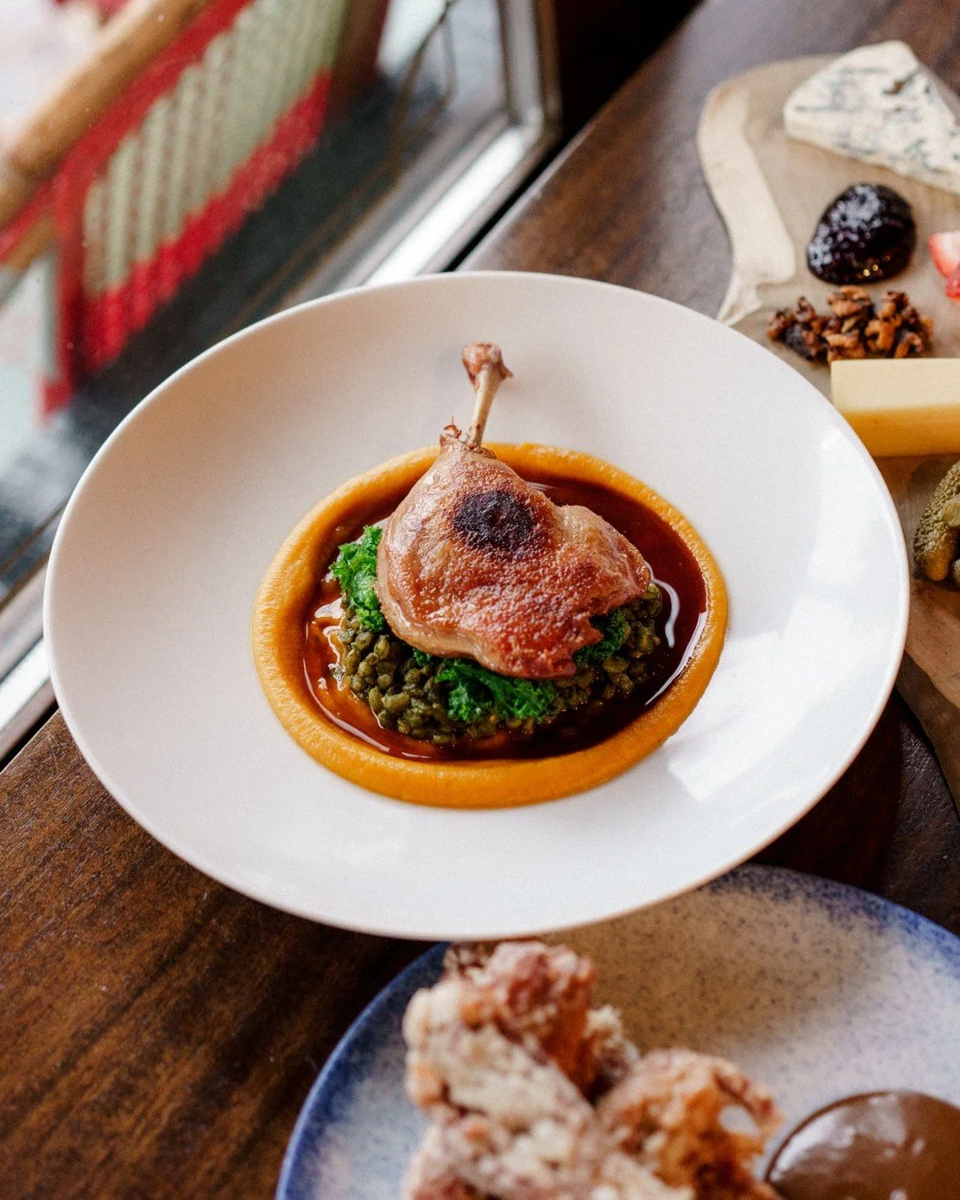 Cuisse de Canard Confite | crispy confit duck leg, herb farro, kale, duck jus⁠
⁠
Duck confit for lunch. The leg is cooked low and slow until the meat pulls apart easily, then crisped up before it goes out. Herb farro, kale, and duck jus make it subst
