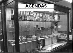 AGENDAS A display case at the old Slinger train depot contains artifacts from the village’s history, including its centennial celebration.
