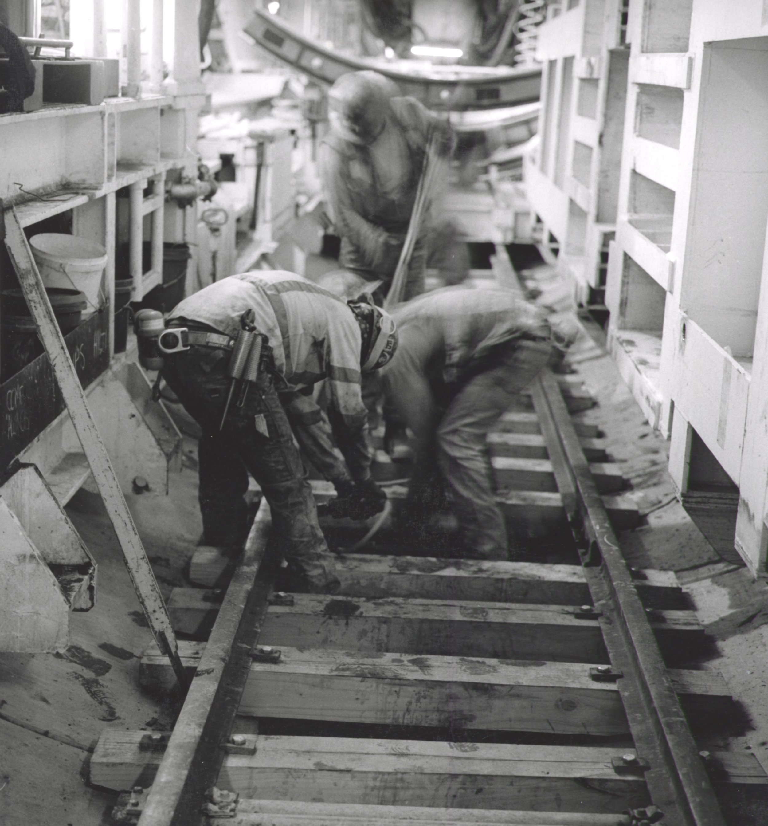 Miners Installing Rail Track Inside TBM