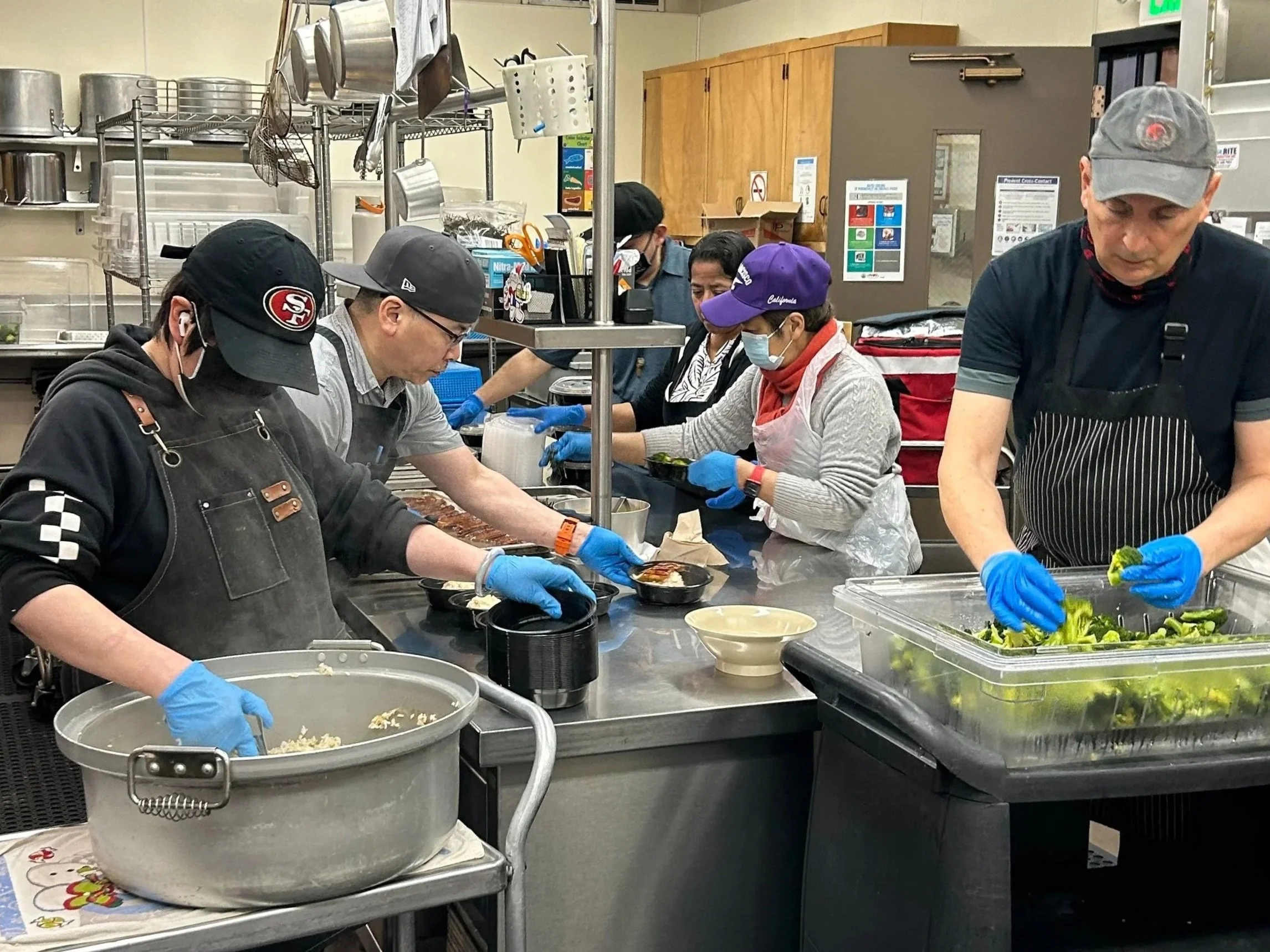 Kitchen staff and volunteers preparing meals for the Home Delivered Meals program.